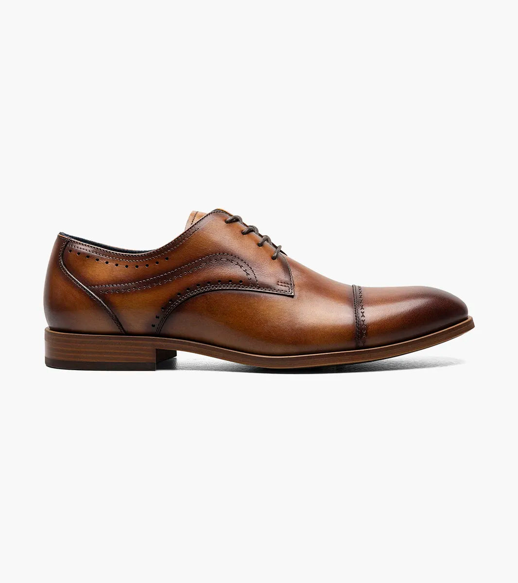 The STACY ADAMS Bryant Cap Toe Oxford (Tan, 25634-240) is a brown burnished leather dress shoe with lace-up closure, anatomical arch support, and a low heel, shown on a white background.