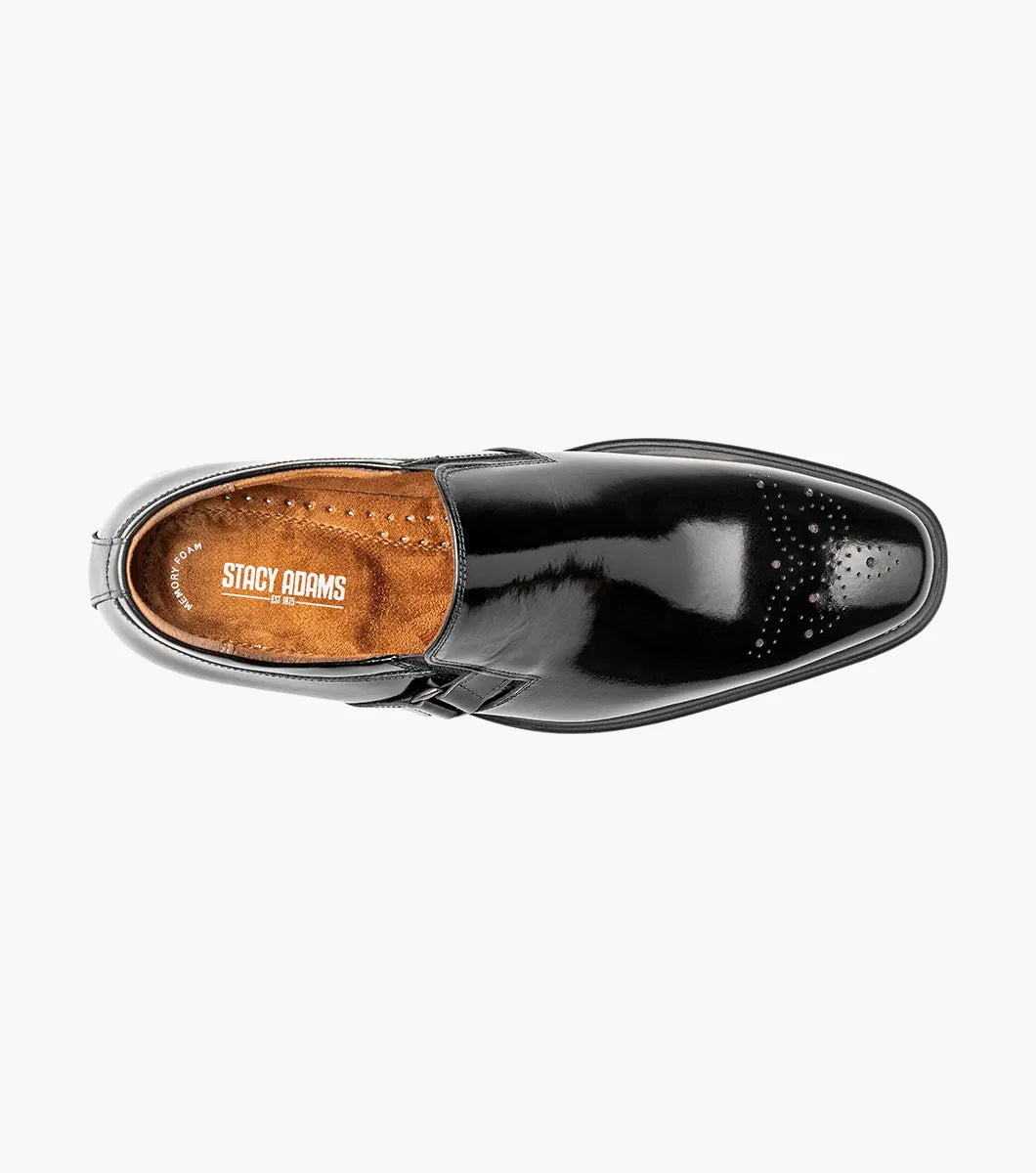 The Stacy Adams Alistair Plain Toe Ornament Slip On in black showcases a sleek leather design with a square toe, decorative stitching on the upper, and an eye-catching side buckle detail. This stylish shoe also features a comfortable memory foam insole and is displayed on a white background.