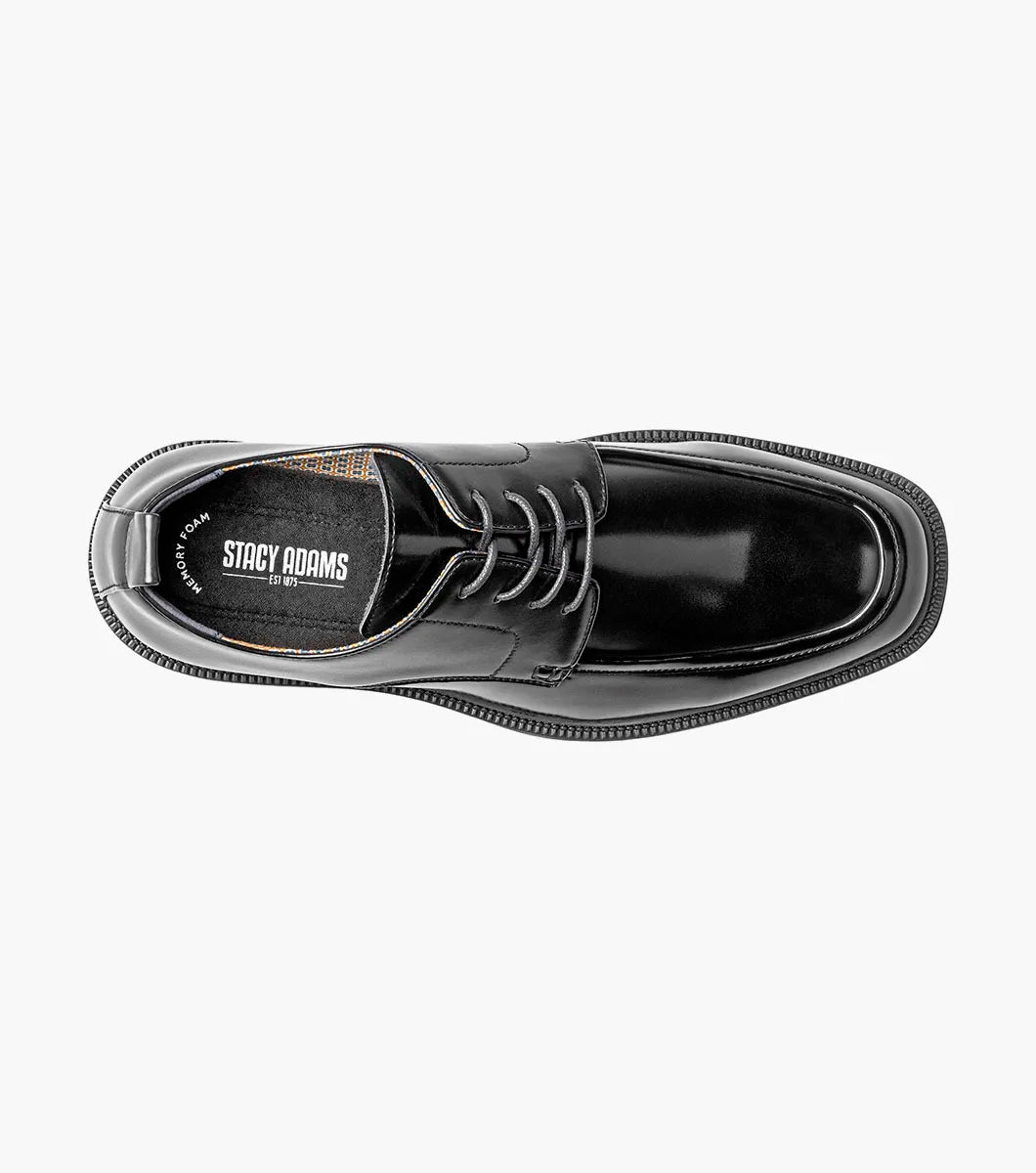 The STACY ADAMS Evan Moc Toe Oxford (Black, 25789-001) is shown as a single men’s dress shoe with a black leather upper, lace-up closure, low heel, and smooth polished finish on a plain white background. Designed for both style and comfort, it features a supportive Memory Foam footbed.