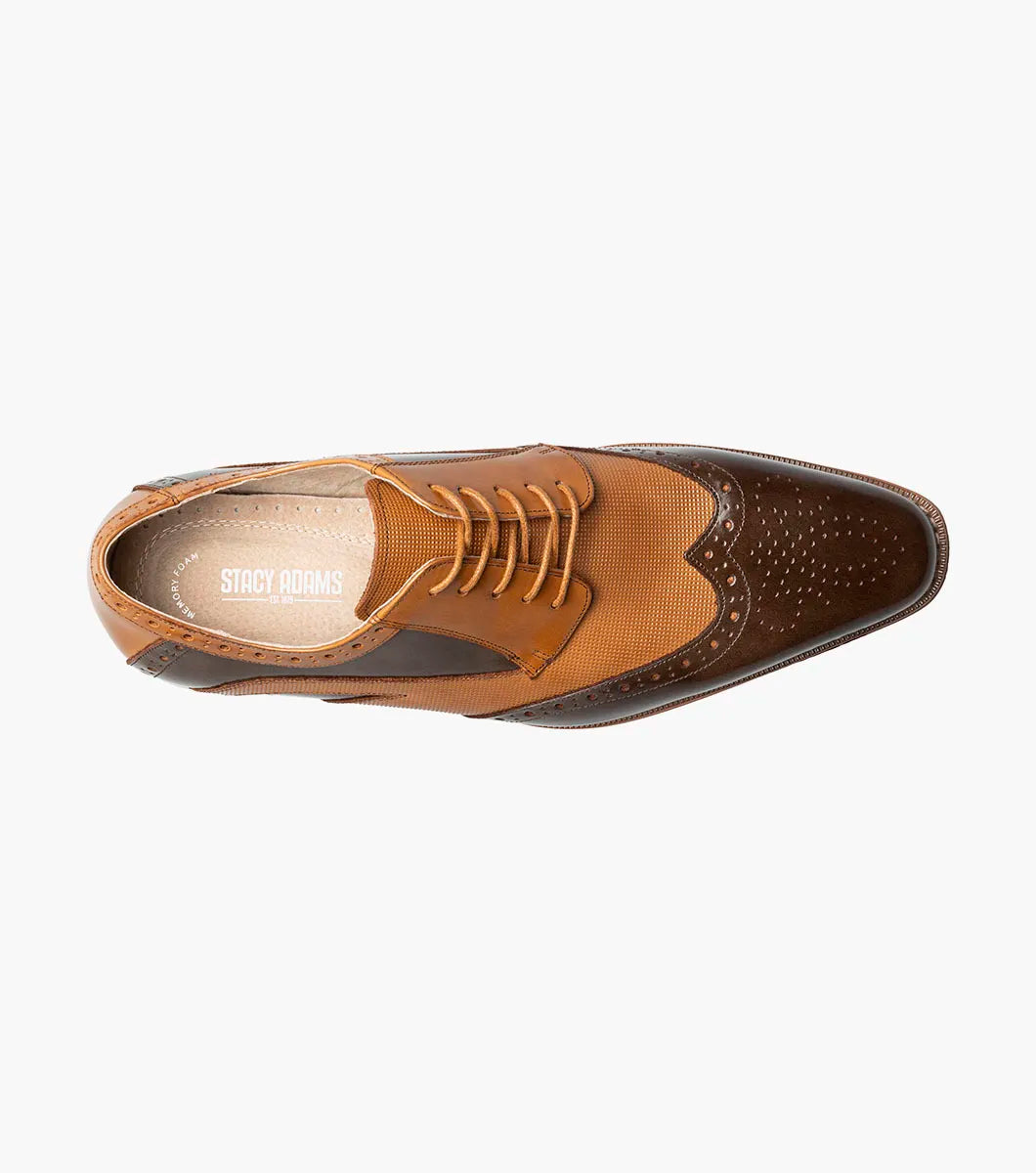 The Stacy Adams Ivingale Wingtip Oxford (Brown Multi, style 25684-249) features brogue detailing, laces, a memory foam footbed, and a low stacked heel. Shown in two-tone brown leather against a white background.
