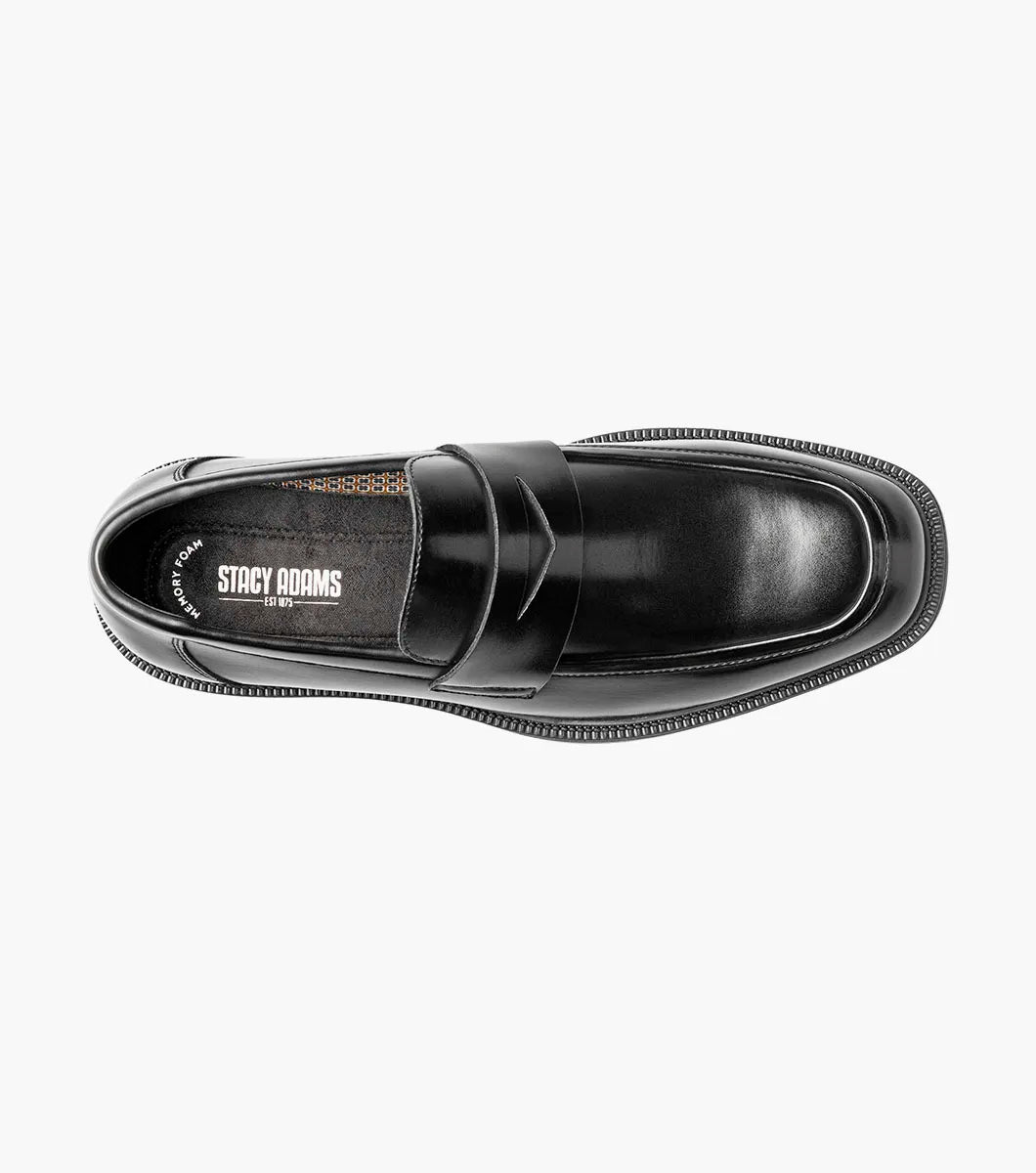 The STACY ADAMS Everett Moc Toe Penny Slip On (style 25790-001) is a single black leather loafer featuring a low heel, polished finish, moc toe stitching detail, and a cushioned insole for enhanced comfort, shown against a plain white background.