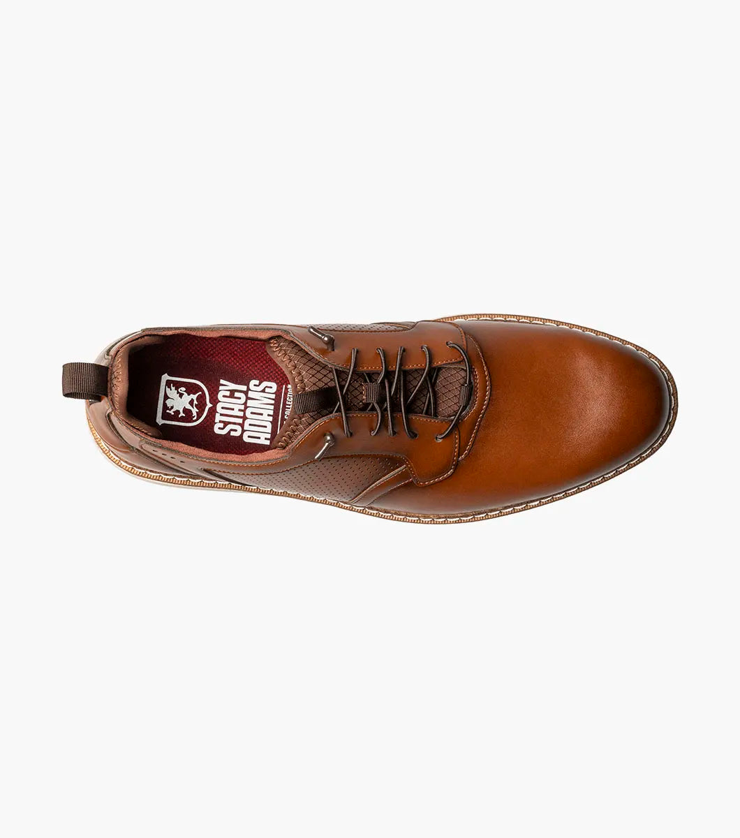 The Stacy Adams Score Plain Toe Elastic Lace Up in Cognac (21538-221) features brown leather with perforated side detailing, elastic laces, and a white rubber sole. Enhanced with a RedZone footbed for superior support and all-day comfort, this STACY ADAMS shoe is displayed against a plain white background.