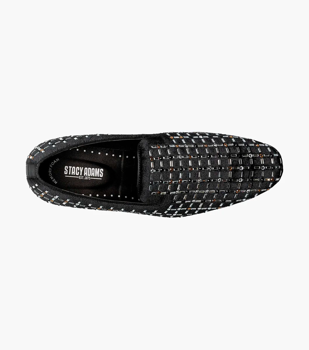 The Stacy Adams Stallford Rhinestone Slip On in Black Multi features a low heel, silver and gold grid-patterned studs, and anatomical arch support, blending dressy style with casual comfort.