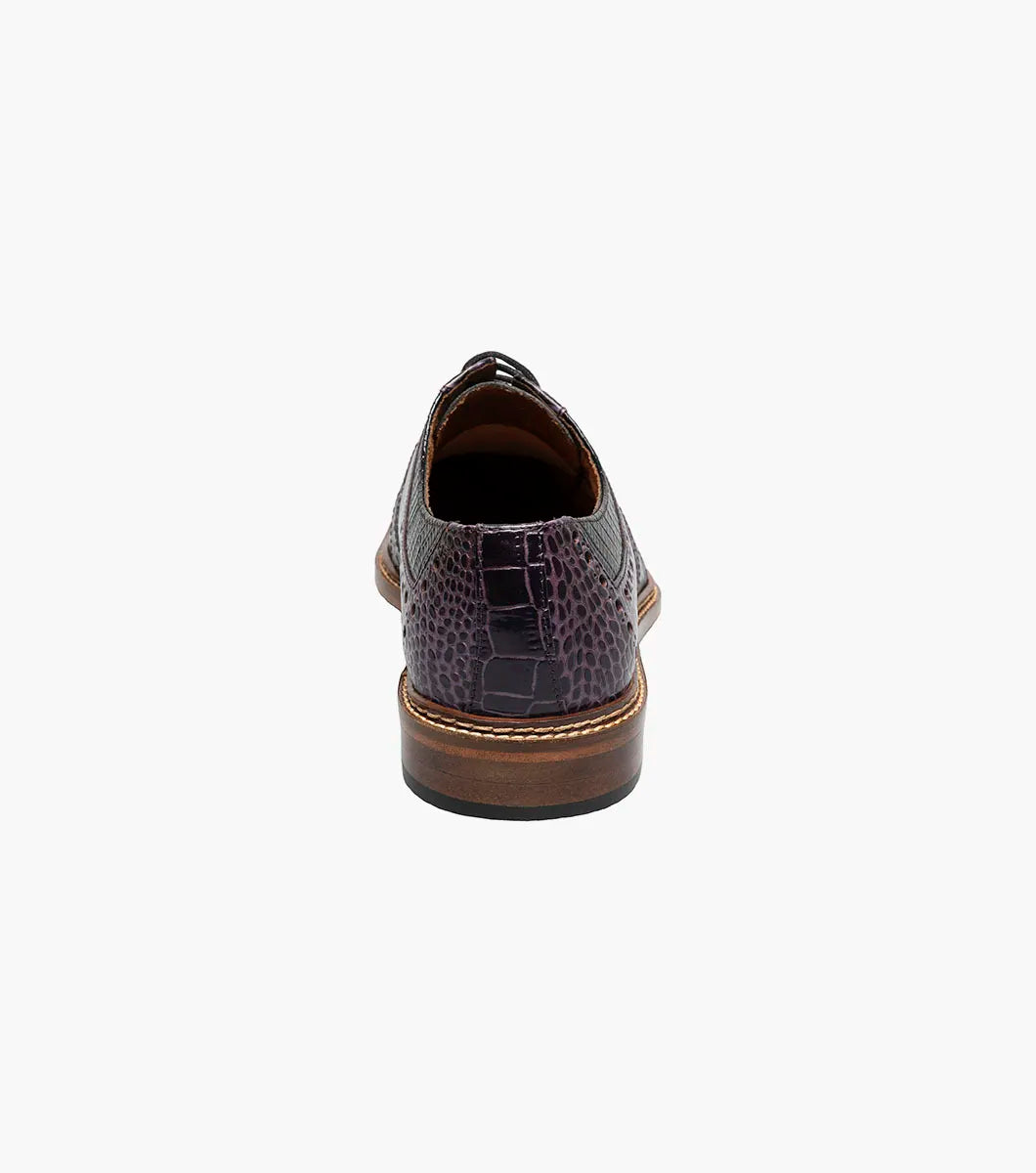 A single STACY ADAMS Travato Wingtip Oxford (Purple Multi, 25737-540) men’s dress shoe with a brown sole and lace-up closure is shown on a white background.