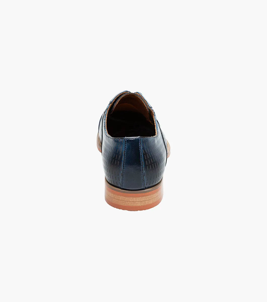 The Stacy Adams Hobson Cap Toe Oxford (25764-400) is a single blue dress shoe with a laser-etched diamond calf leather pattern, lace-up closure, brown sole, and sleek pointed toe.