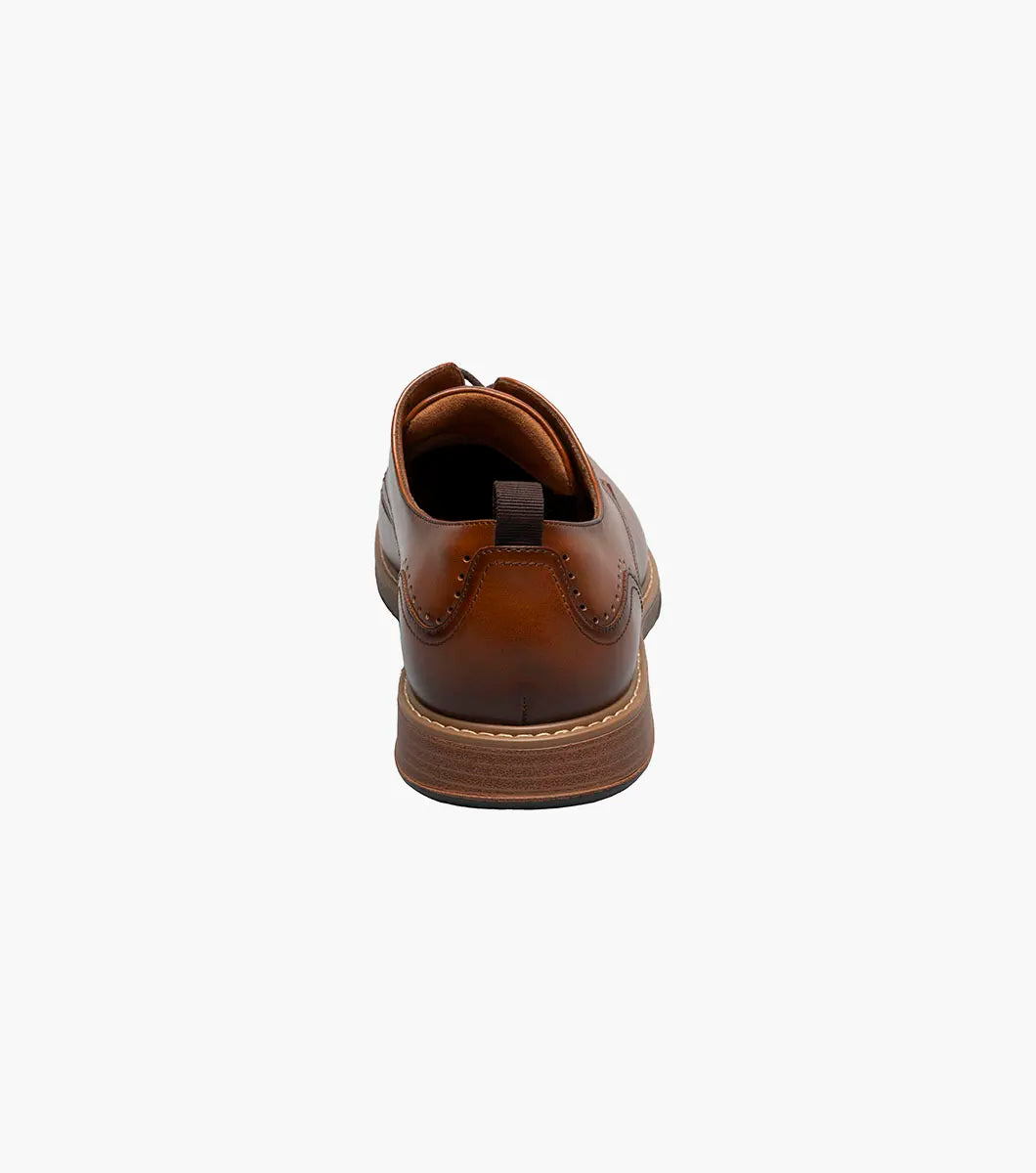 The Stacy Adams Pacer Plain Toe Oxford in Cognac (25754-221) is shown on a white background—its classic lace-up design and low heel make it ideal for both dress casual and formal occasions.