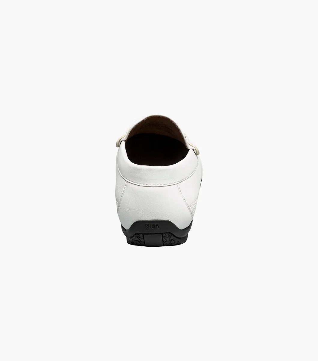 The STACY ADAMS Colton Moc Toe Bit Slip On (White, 25760-100) is a men's leather loafer with a silver bit detail, black sole, patterned heel lining, and cushioned footbed for all-day comfort.