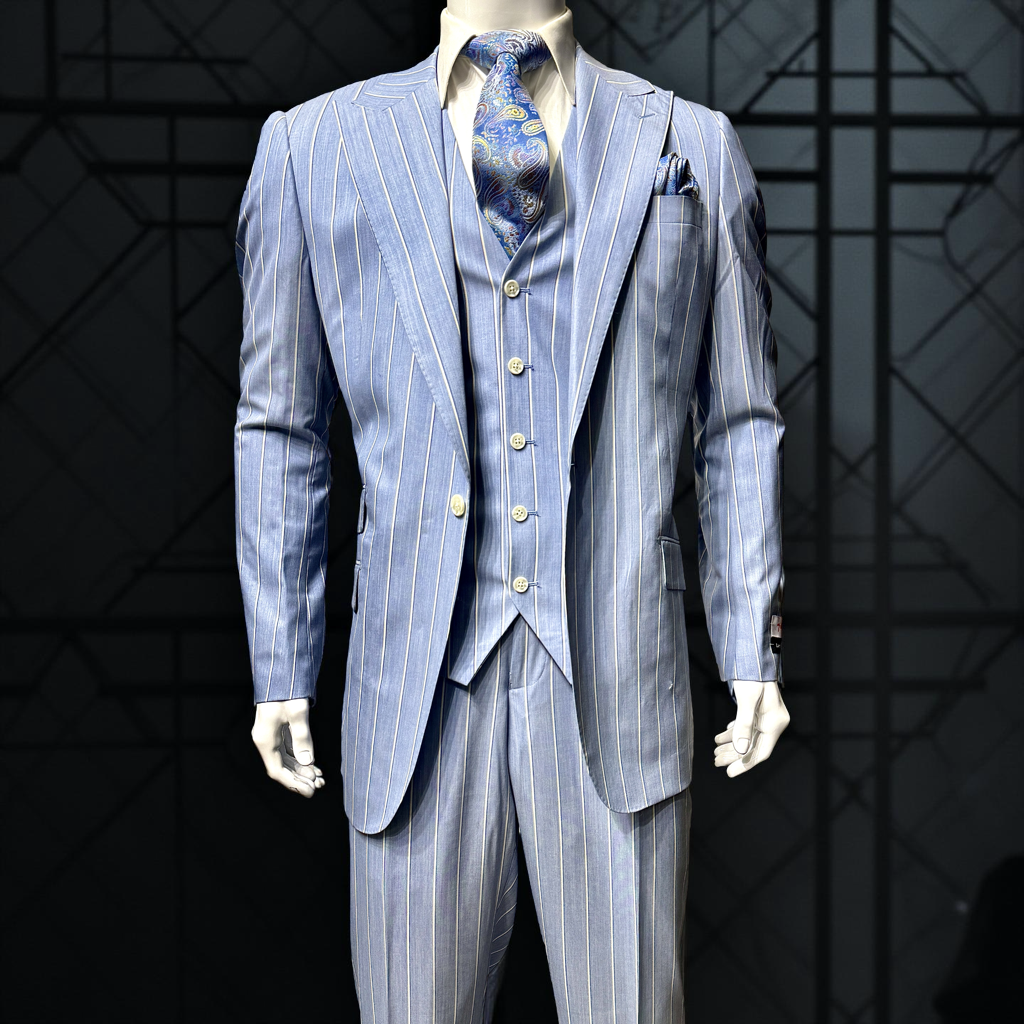 A mannequin showcases the Tiglio Rosso Portofino Blue Pinstripe Semi Wide Leg TL8099 suit, paired with a patterned tie, white shirt, and black dress shoes, set against a plain gray background.
