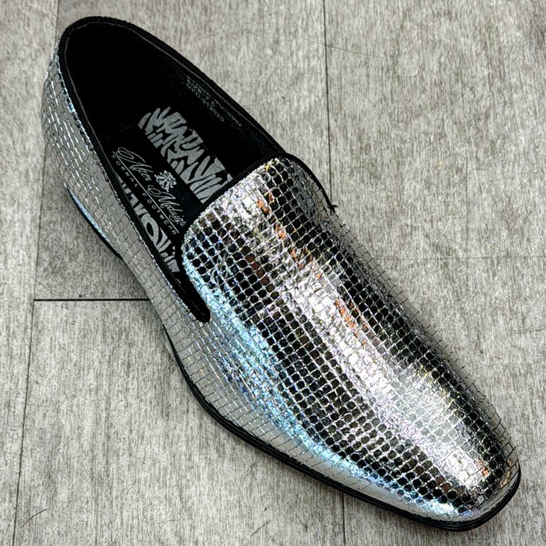 The Exclusive Formal Dress Shoe Silver 6882 by UNIQUE DESIGN MENSWEAR, featuring a metallic and sequined genuine leather design, rests elegantly on a gray floor.