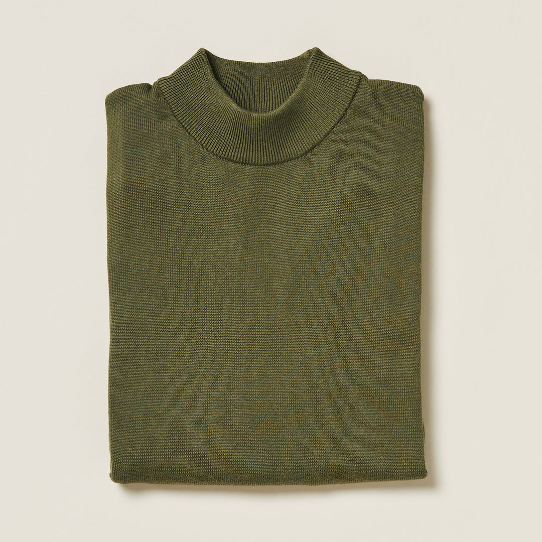 The Inserch Cotton Blend Mock Neck Sweater in olive (4308-00019), made from an anti-pilling cotton-acrylic blend, is shown folded on a light beige background.