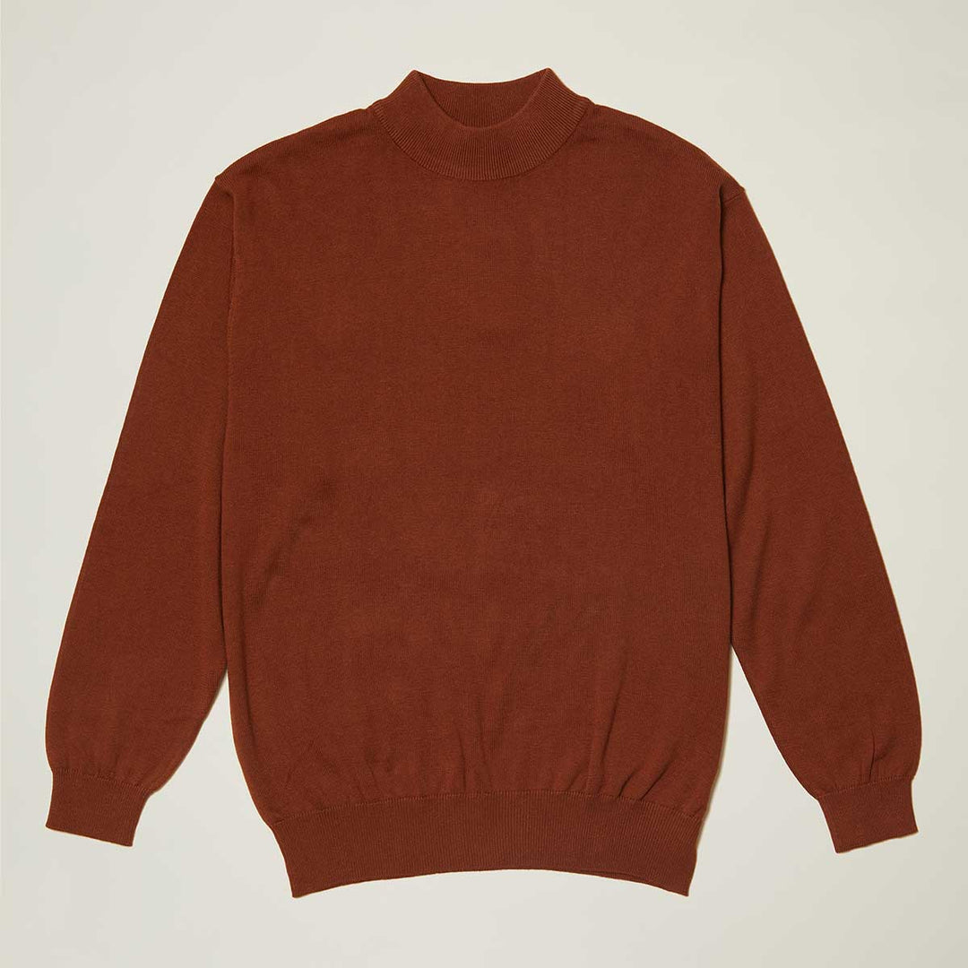 The Inserch Cotton Blend Mock Neck Sweater Aztec 4308-00027 is a rust-colored, regular fit, long-sleeve sweater with a high crew neckline, ribbed cuffs and hem, crafted from a soft cotton blend.