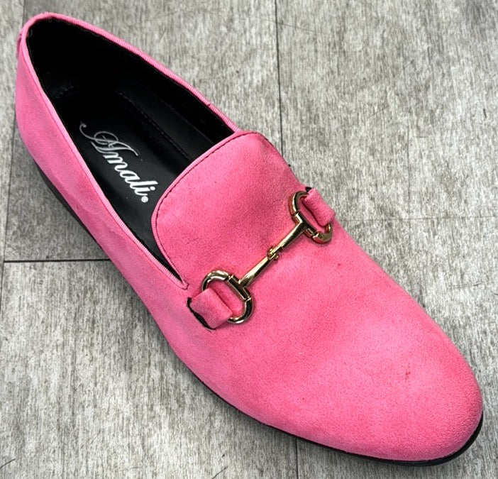 The "Exclusive Formal Dress Shoe Pink BRADFORD" by UNIQUE DESIGN MENSWEAR lies gracefully on a gray tiled floor, showcasing Italian sophistication with its pink suede leather and gold decorative buckle.