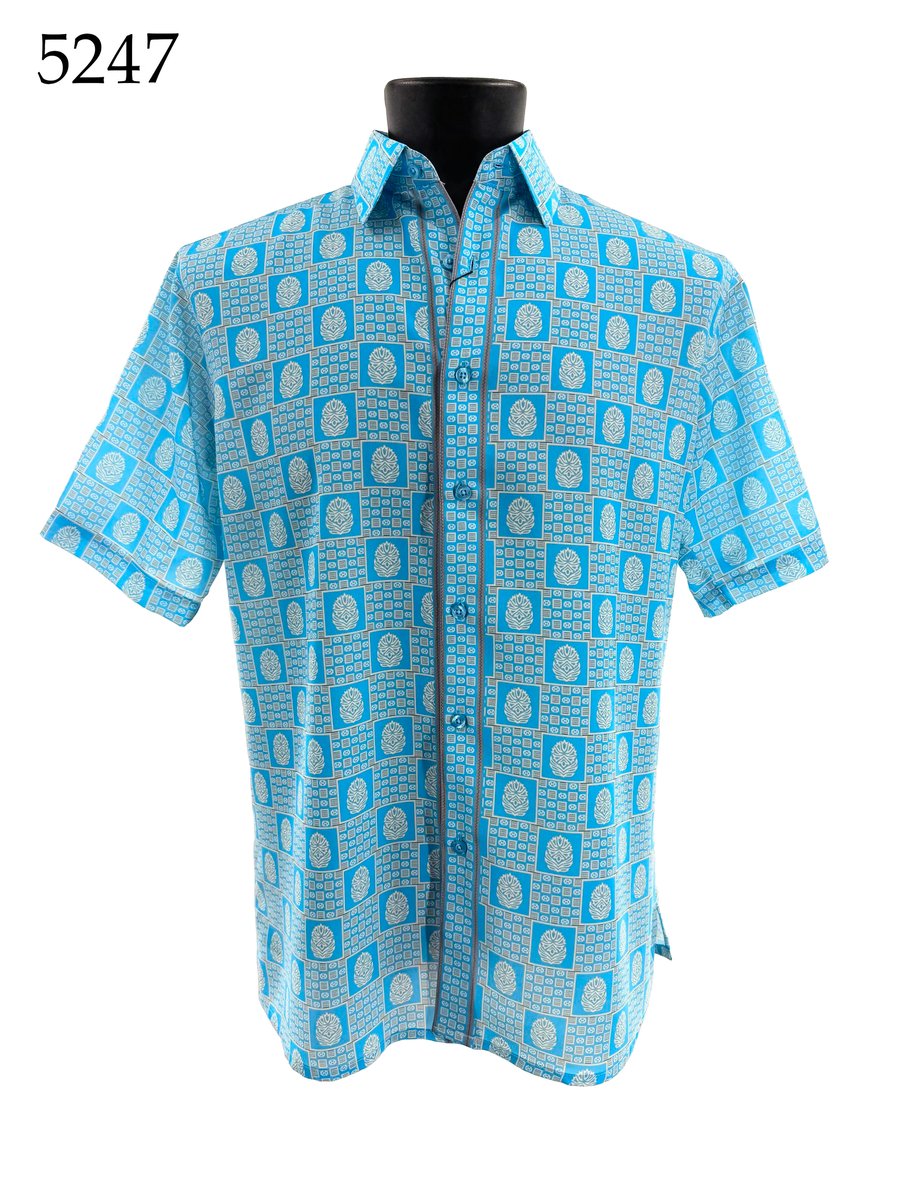The Bassiri Short Sleeve Shirt 5247 by Bassiri features a button-up, regular fit style with a blue and white geometric pattern, shown on a black mannequin. "5247" appears in the top left corner.