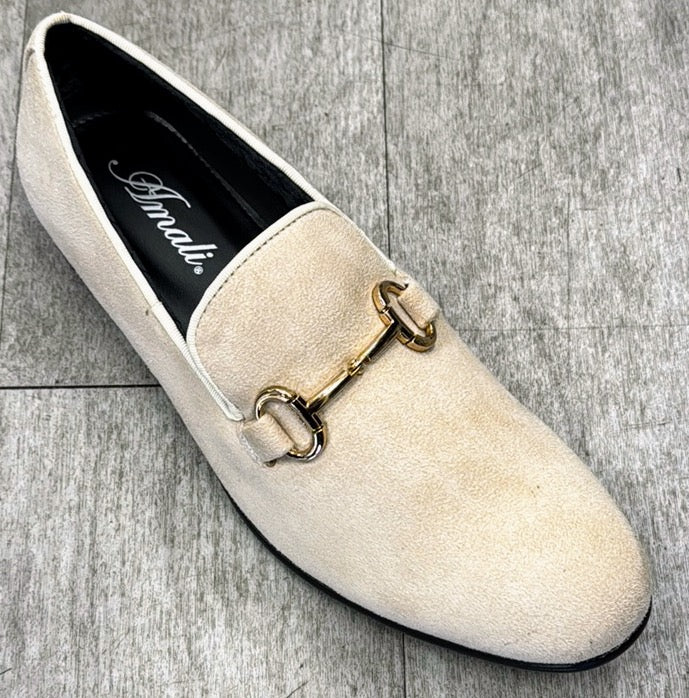 The Exclusive Formal Dress Shoe Tan BRADFORD by UNIQUE DESIGN MENSWEAR, featuring white suede leather and a gold buckle on top, is beautifully displayed on a gray tiled floor, epitomizing the exquisite craftsmanship synonymous with Italy.