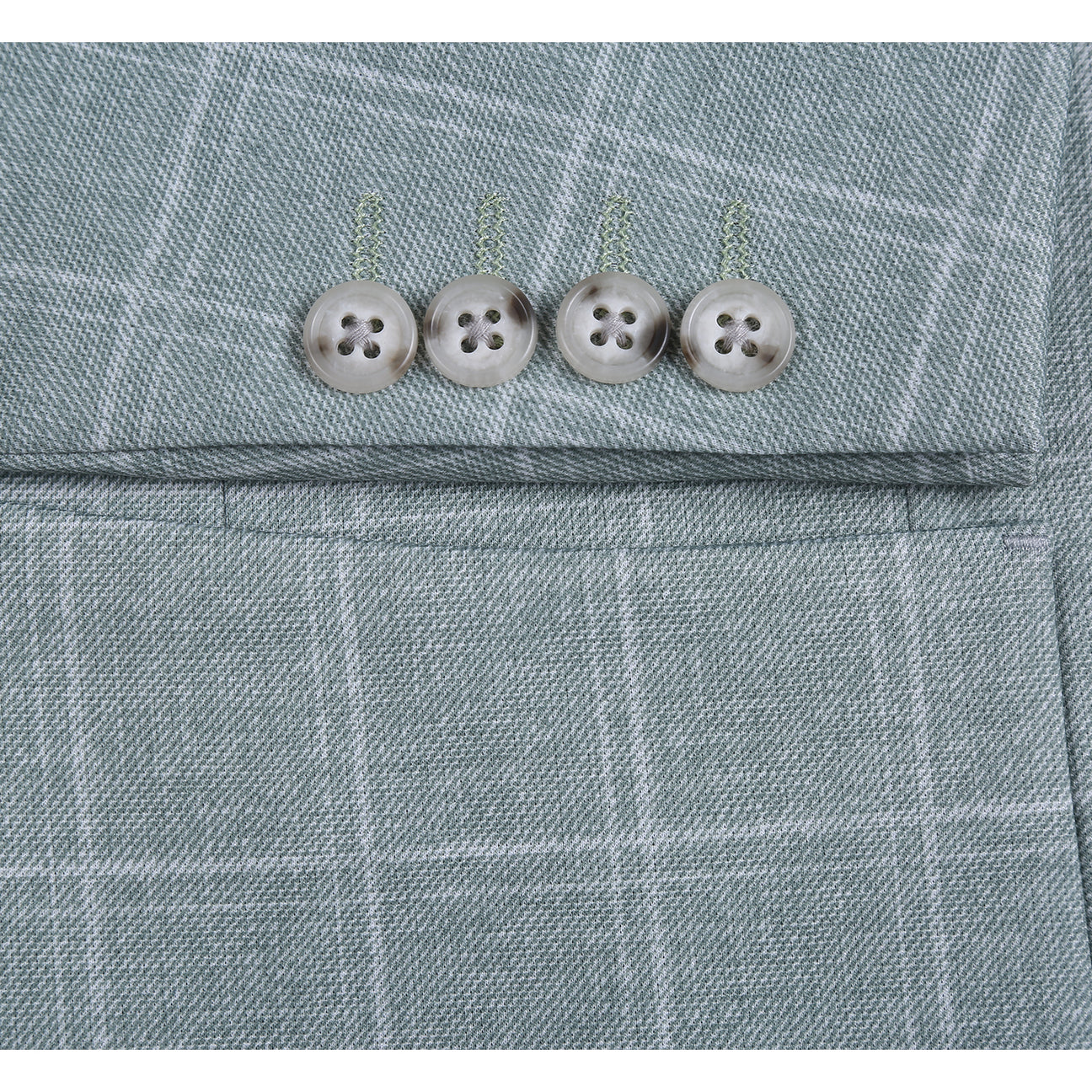 The Pellagio Light Green Men's Slim Fit Riserva Jacket PS26-9, styled with a white dress shirt, striped tie, and patterned pocket square, is displayed on a mannequin.