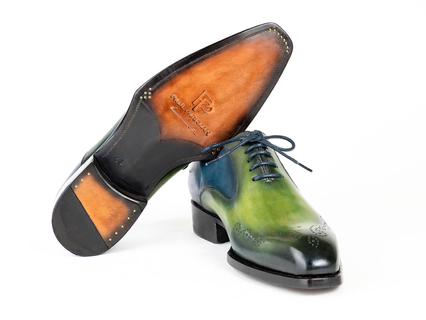 Introducing the Paul Parkman Goodyear Welted Punched Oxfords in Blue & Green (5364-GBL), a pair of hand-painted leather dress shoes featuring a stunning green and blue gradient, laces, decorative perforations, and crafted with a Goodyear welted sole.