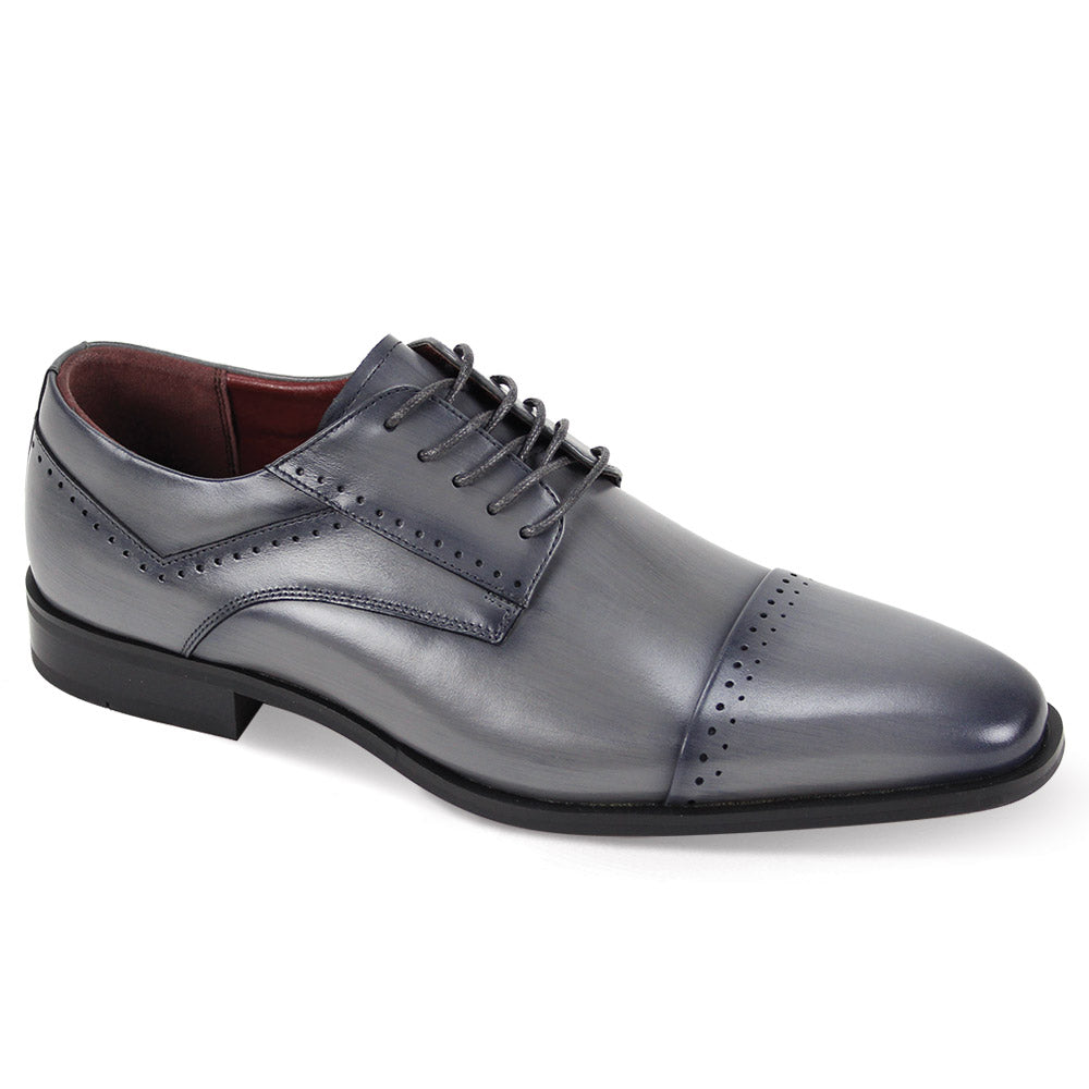 The Giorgio Venturi Giorgio 7033 Grey Leather Shoes feature a single gray leather design with lace closure, a perforated cap toe, and a low black heel.