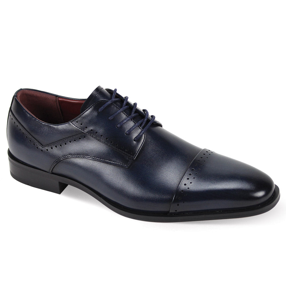 The Giorgio Venturi Giorgio 7033 Navy Leather Shoe features a cap toe lace-up design with decorative perforations on the toe and sides, displayed against a white background.