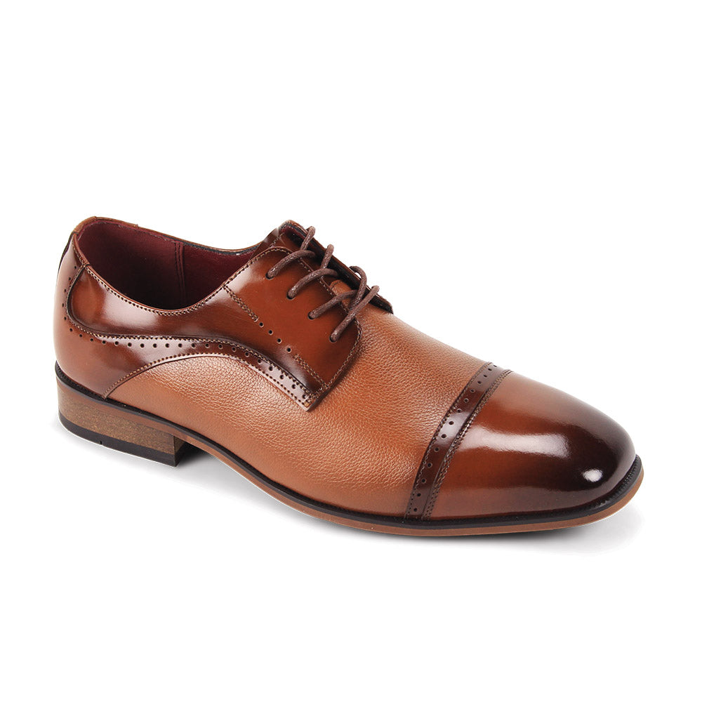The Giorgio Venturi Giorgio 7076 Tan Leather Shoes are brown oxfords with a genuine leather upper, cap toe, brogue detailing, and laces, shown on a white background.