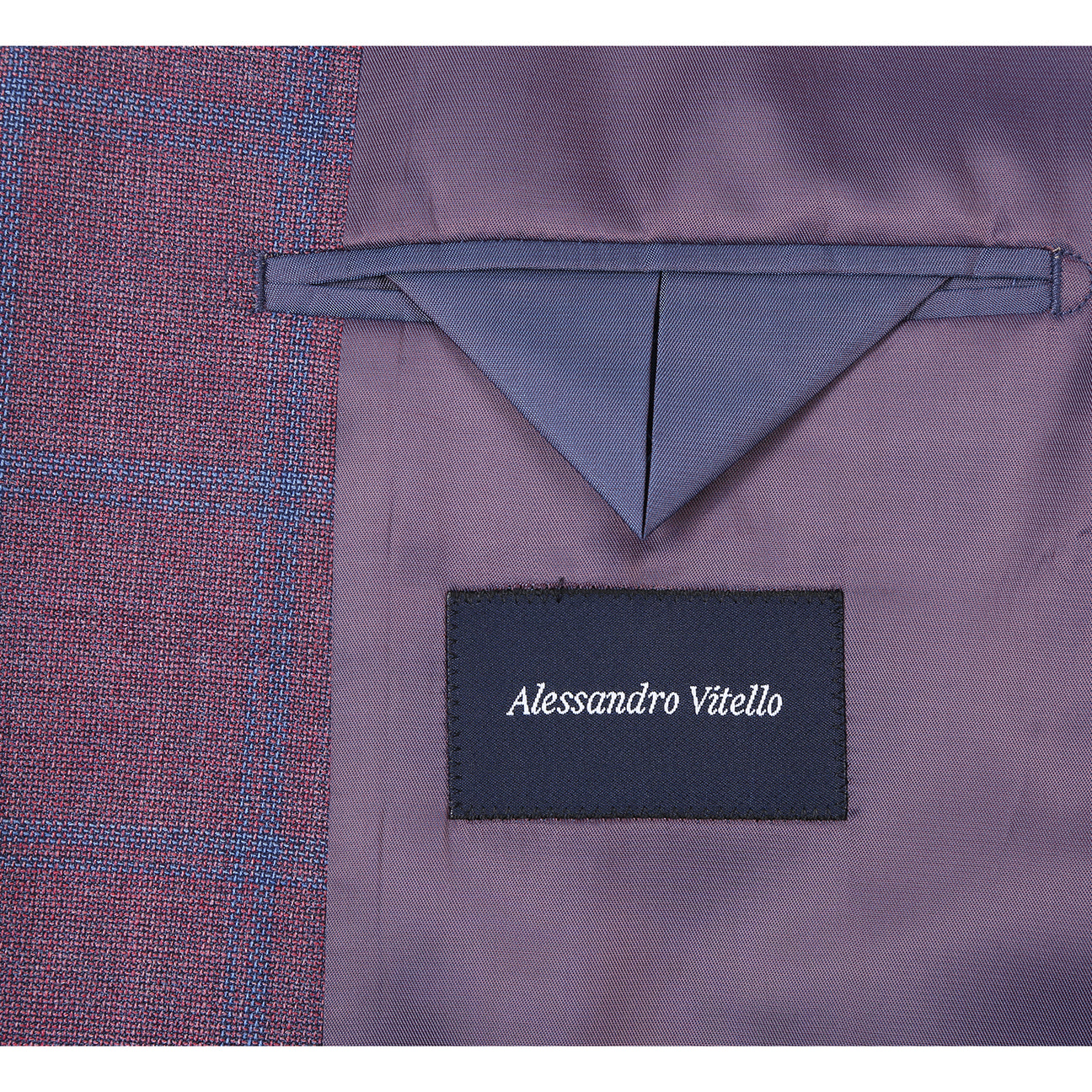 A mannequin wearing the Renoir Alessandro Vitello by Renoir New Slim Fit Sport Coat 565-17, styled with a white dress shirt, navy polka dot tie, and floral pocket square.