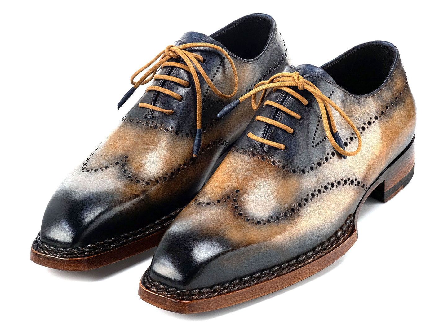 Paul Parkman Goodyear Welted Men's Wingtip Oxfords (Camel & Navy, 81CML62) feature handmade brogue detailing, hand-painted leather, and brown soles. Displayed on a white background.