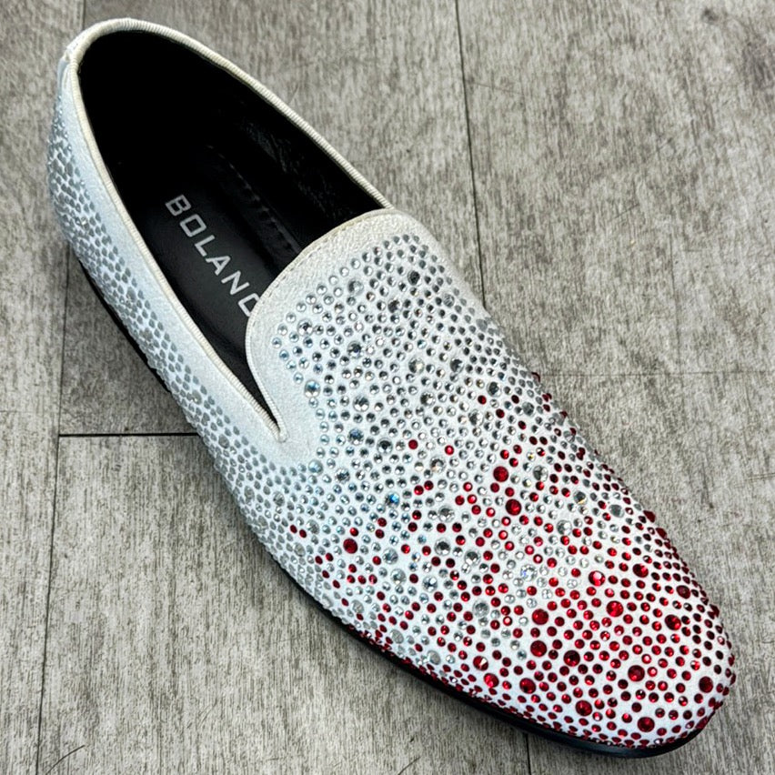 The Exclusive Formal Dress Shoe Red/White FROST from UNIQUE DESIGN MENSWEAR, crafted from genuine leather and embellished with white and red rhinestones, rests elegantly on a wooden floor.