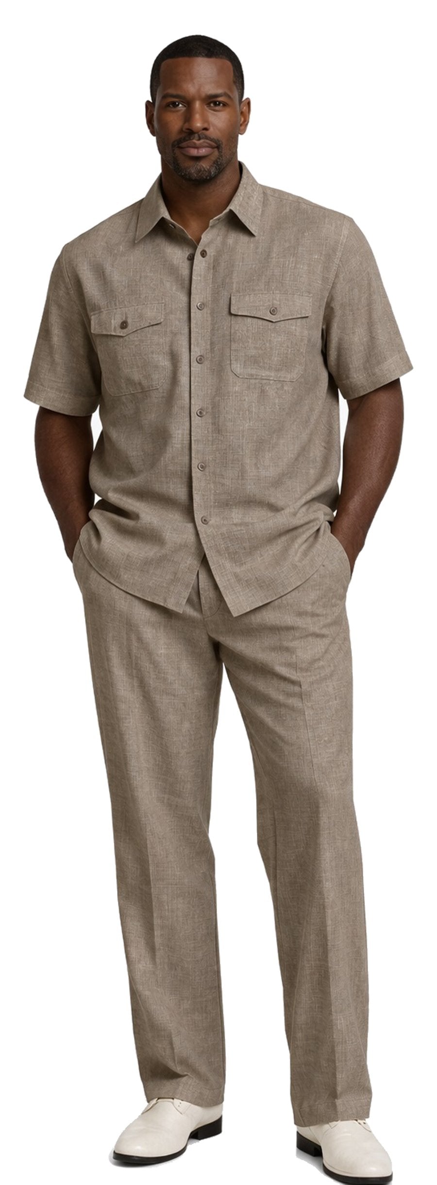 A man stands with hands in pockets, wearing the Bassiri Brown 2pc Set A 145 by Bassiri—featuring a short-sleeve button-up shirt and matching pants—paired with white shoes.