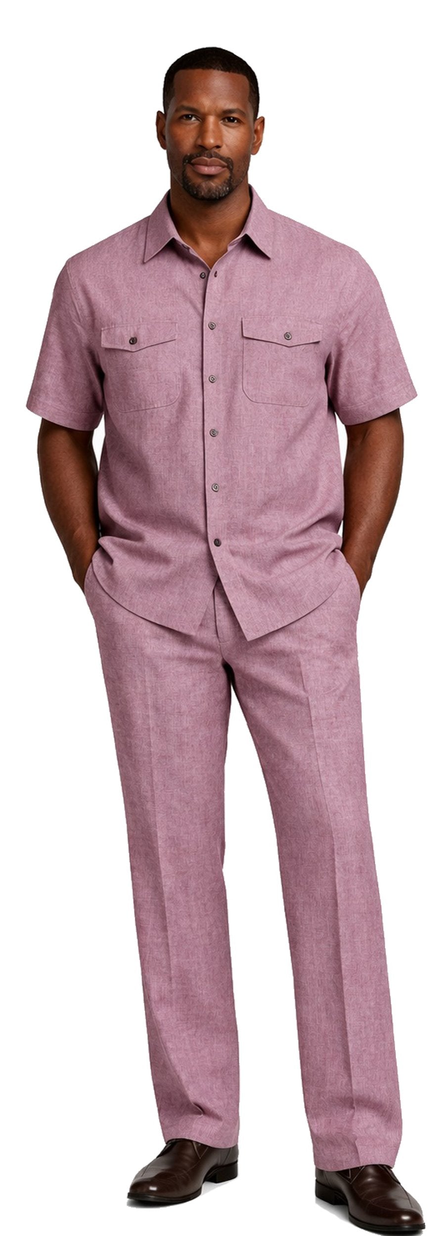 A man stands with hands in pockets, wearing the Bassiri Burgundy 2pc Set A 145—a short-sleeve button-up shirt and matching trousers by Bassiri—paired with brown shoes.