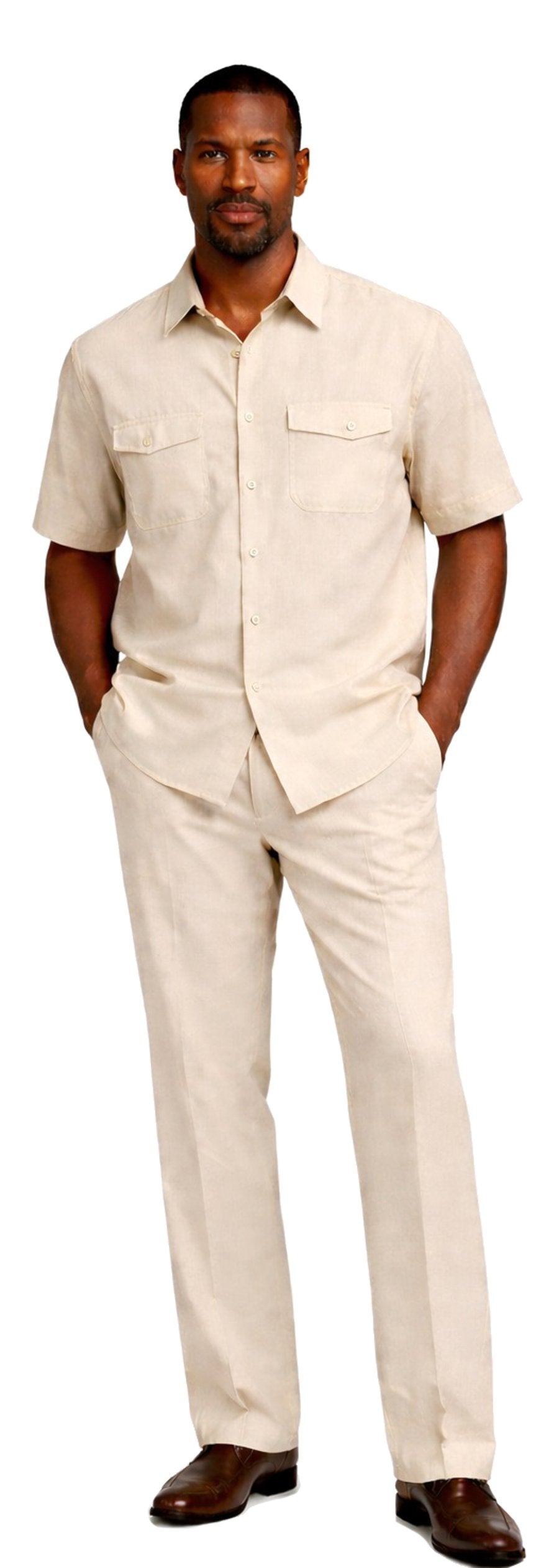 A man stands with hands in pockets, dressed in the Bassiri Cream 2pc Set A 145 by Bassiri, paired with brown shoes.