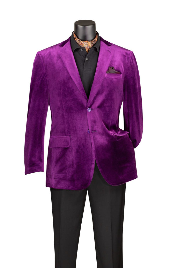 The Vinci Suits Velvet Regular Fit Fashion Jacket Purple B-27, featuring a notch lapel and two buttons, is styled with a black shirt, patterned scarf, and sleek black trousers on a mannequin.