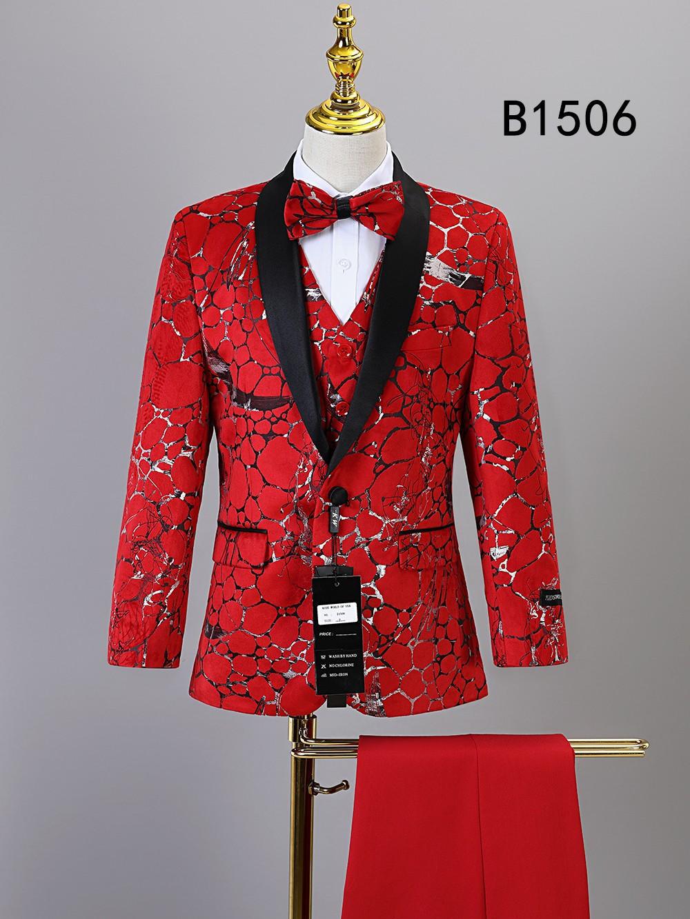 The Unique Design Menswear BOY SUIT 5-PC SET B1506 features a bold red and black abstract design with jacket, pants, vest, white shirt, and matching red bow tie—displayed on a mannequin. Perfect boy's suit set.