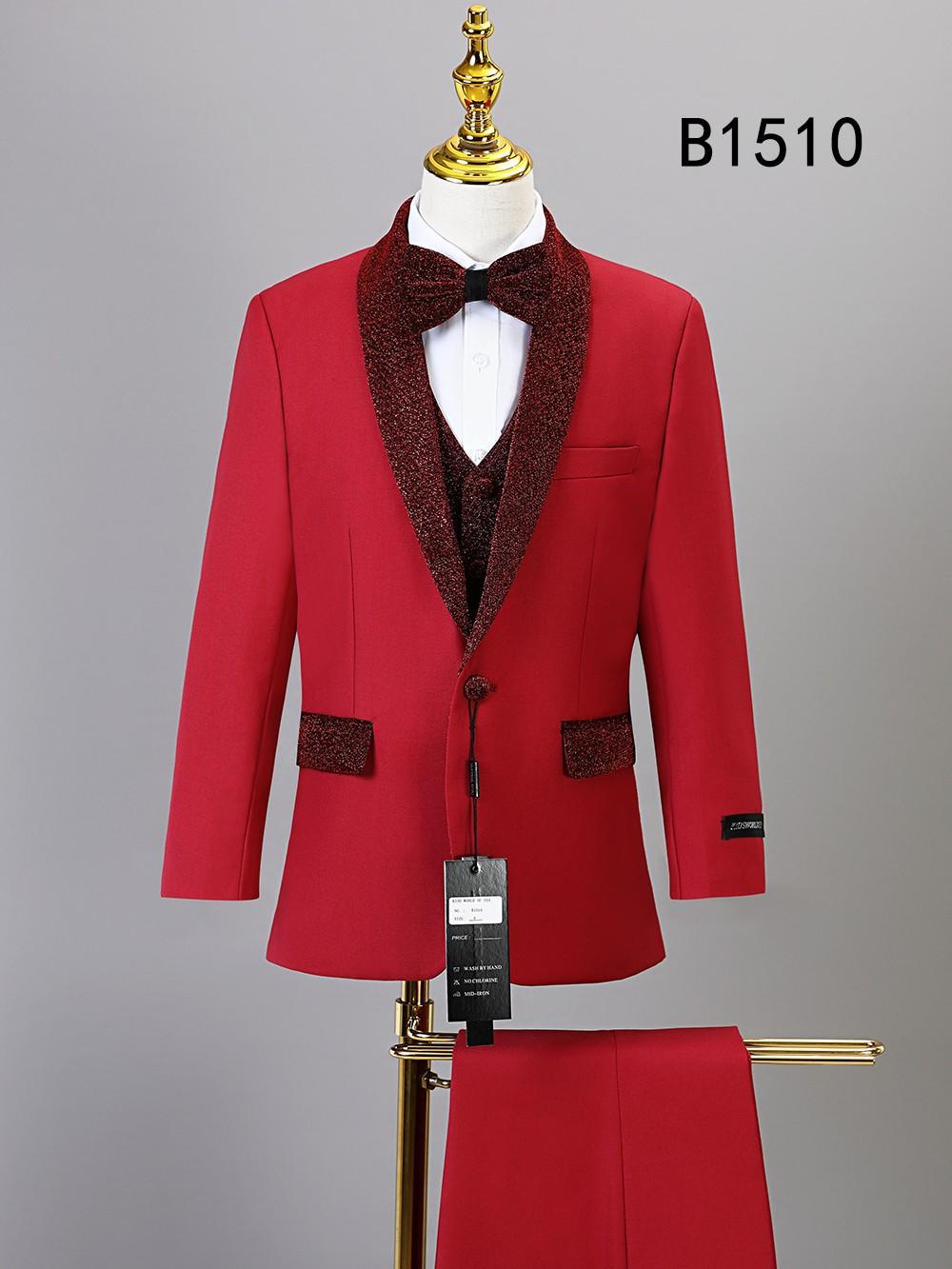 The BOY SUIT 5-PC SET B1510 by Unique Design Menswear features a red suit with black lapels, matching trousers, and bow tie on a mannequin. Ideal boys' formal wear; product code "B1510" displayed in the top right corner.