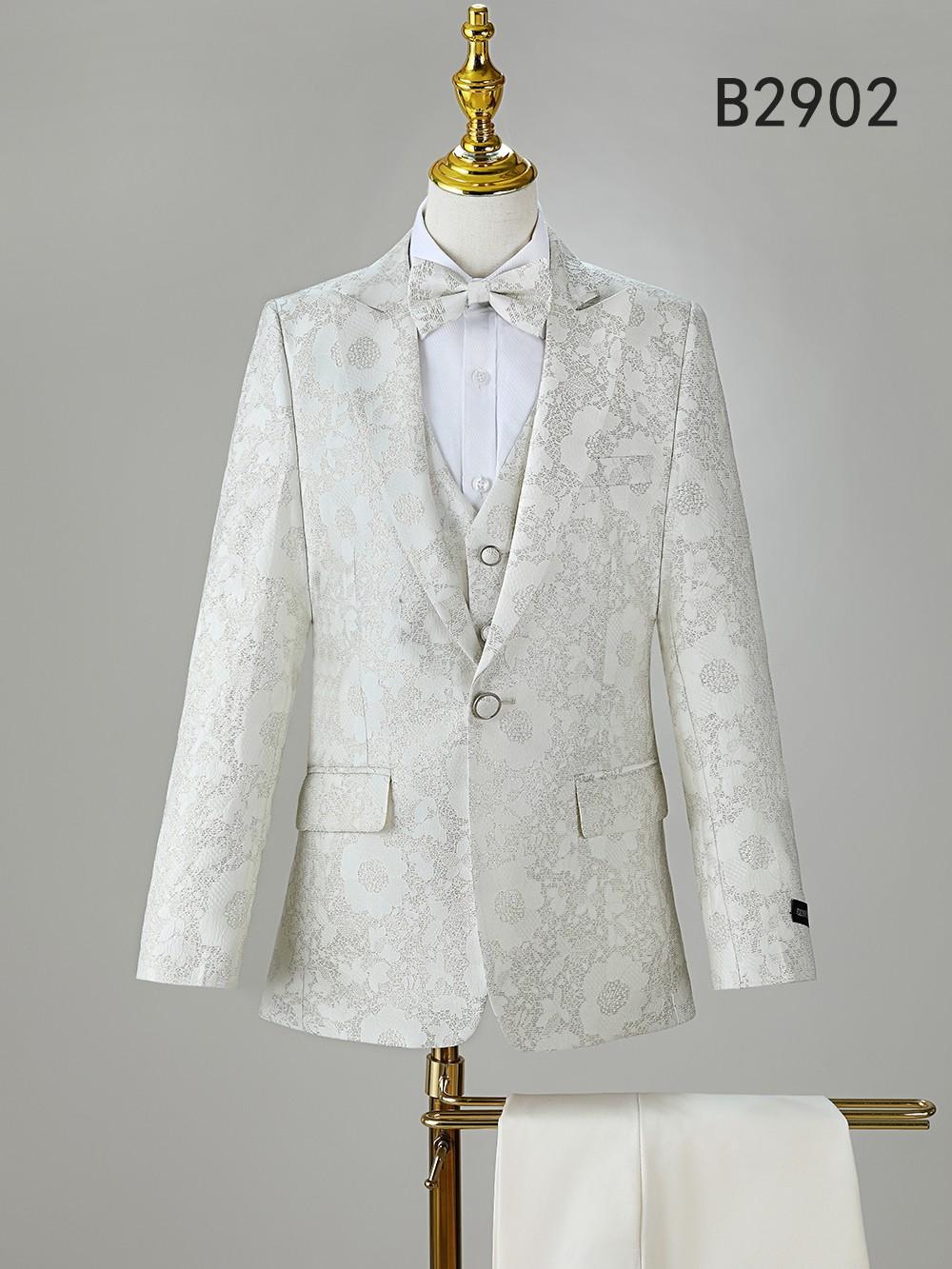 The Unique Design Menswear BOY SUIT 5-PC SET B2902 includes a floral white suit jacket, matching vest, dress shirt, bow tie, and pants. Stylish formalwear for boys—ideal for special occasions.