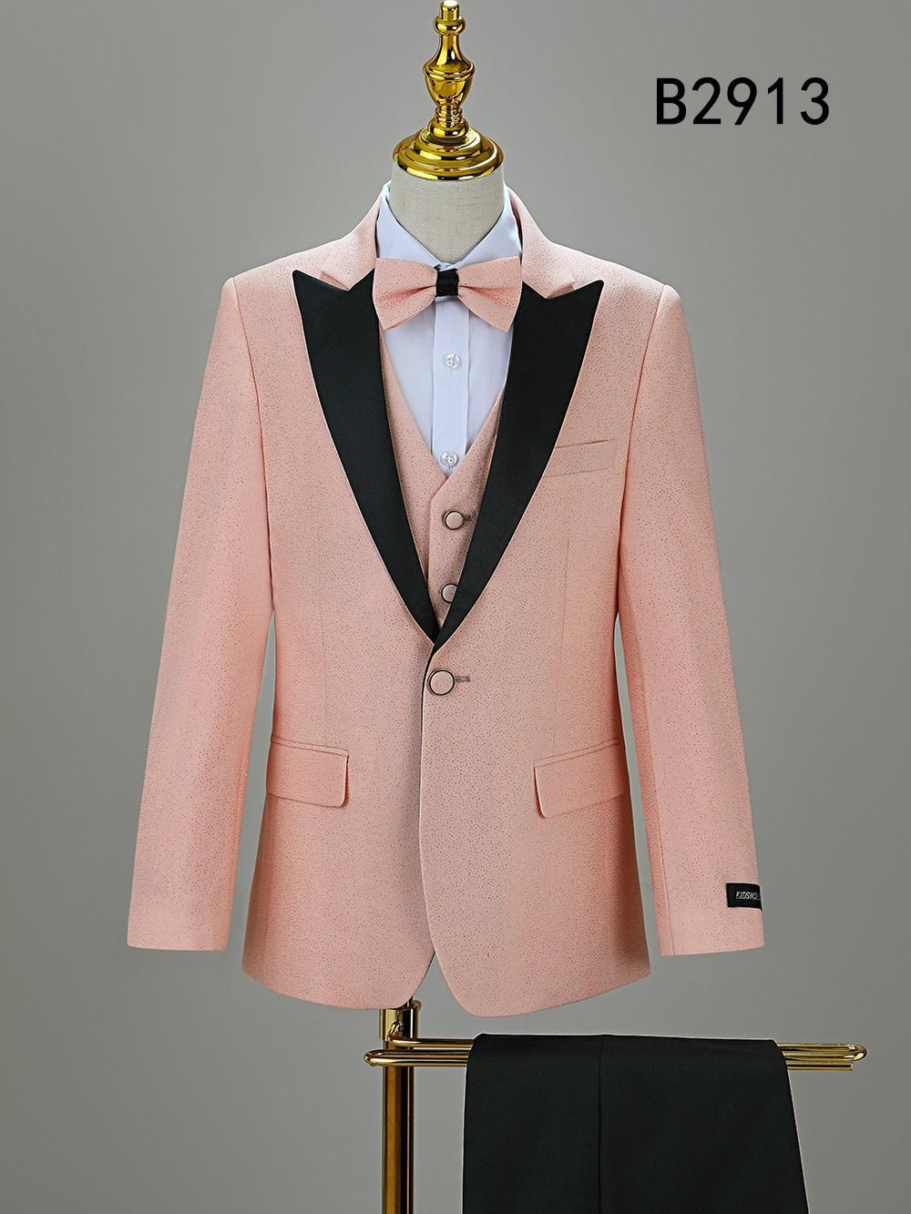 The Unique Design Menswear BOY SUIT 5-PC SET B2913 is a light pink boys' formal suit with black lapels, white shirt, bow tie, and black pants—displayed on a mannequin and perfect for any special occasion.