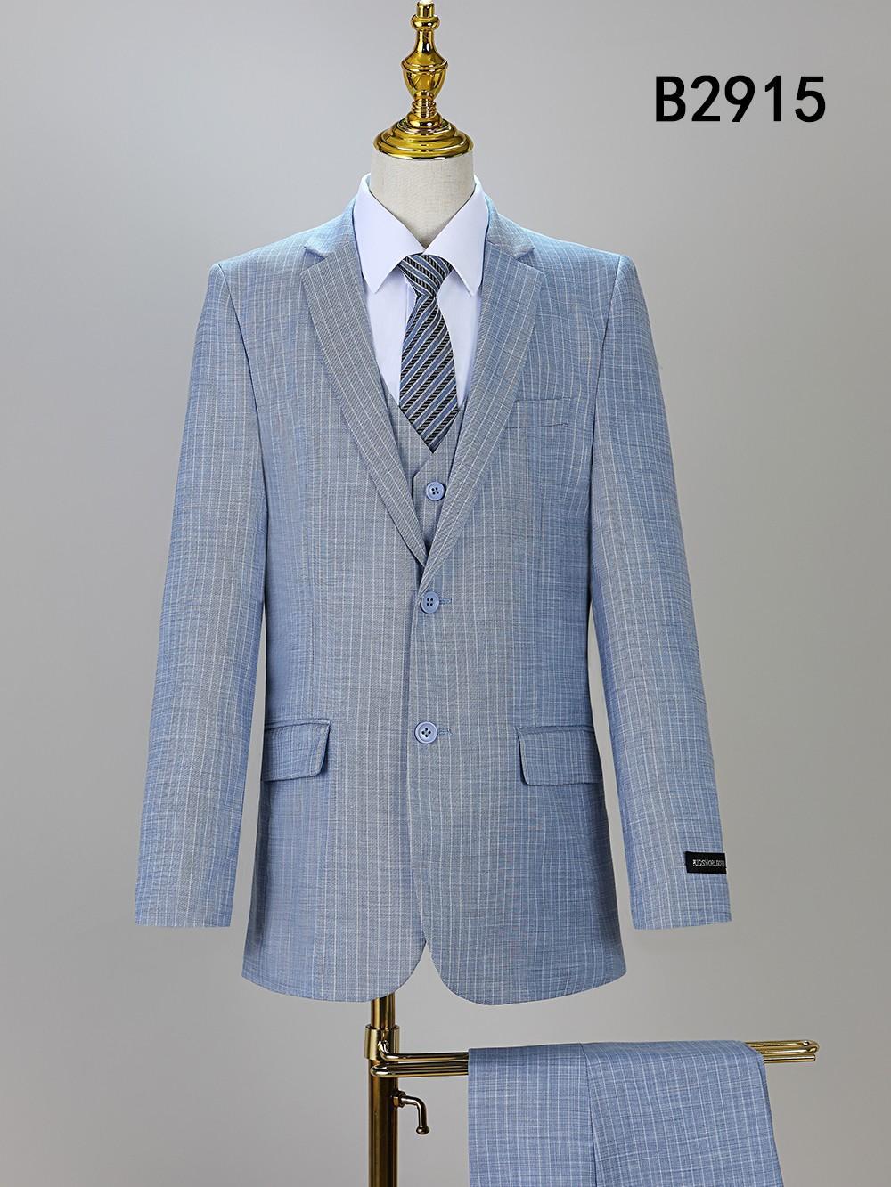 The BOY SUIT 5-PC SET B2915 by Unique Design Menswear features a light blue checkered formal suit with matching vest, pants, white shirt, and striped tie, displayed on a mannequin; label "B2915" in the top right corner.