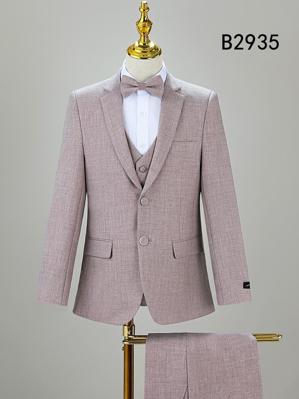 The BOY SUIT 5-PC SET B2935 by Unique Design Menswear, shown on a mannequin with a bow tie and matching trousers on a stand, features code "B2935" in the upper right corner.