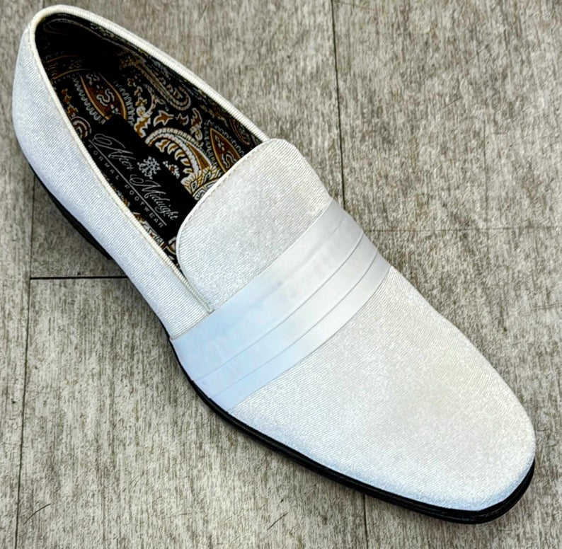 The Exclusive Formal Dress Shoe White 7021 by UNIQUE DESIGN MENSWEAR is a white textured loafer made from genuine leather with a white strap, a paisley-patterned interior, and a black sole on a wood floor.