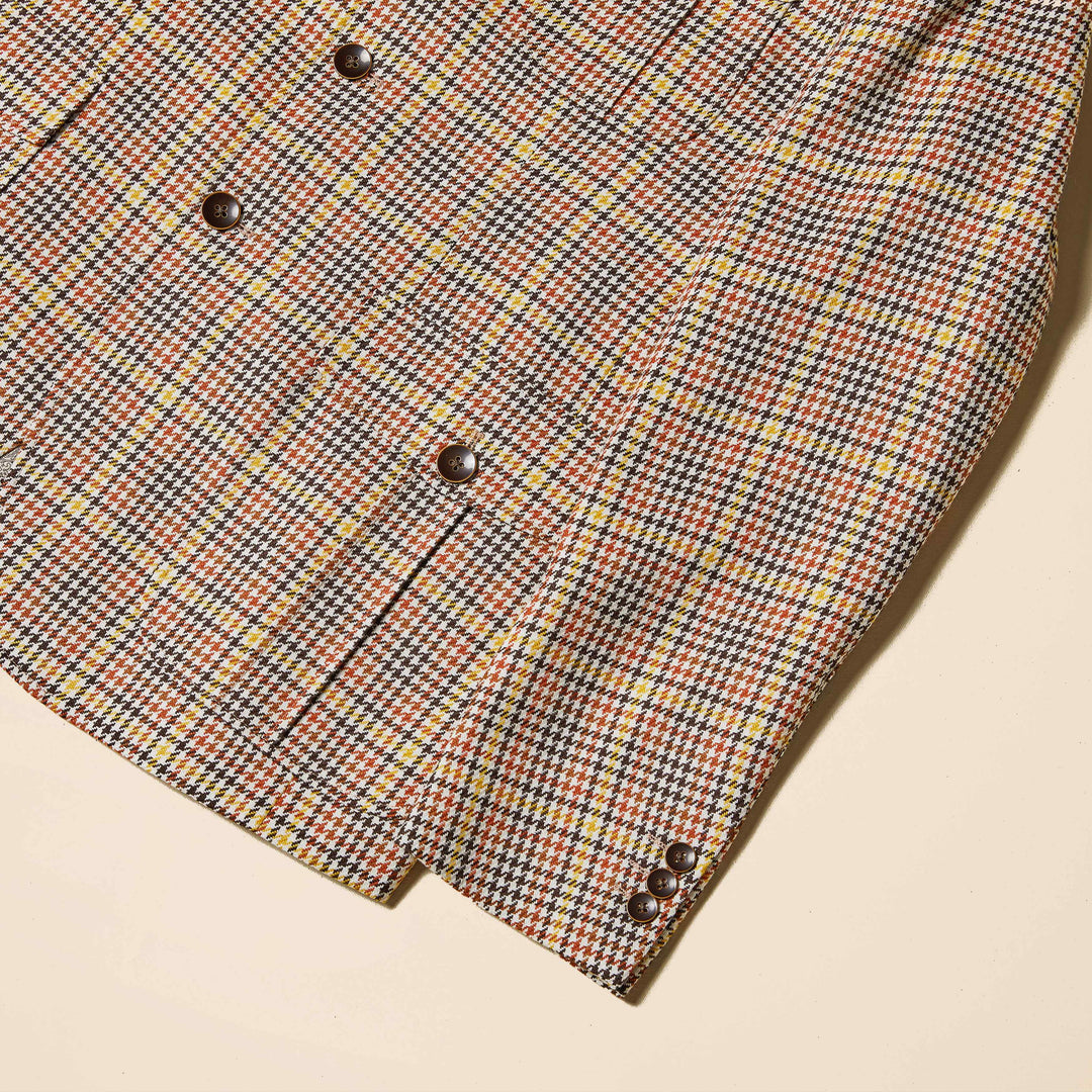 Close-up of the Inserch Mini-Houndstooth Blazer BL265-64 Mocha, featuring a brown, yellow, and red pattern with dark buttons on the sleeve and front.