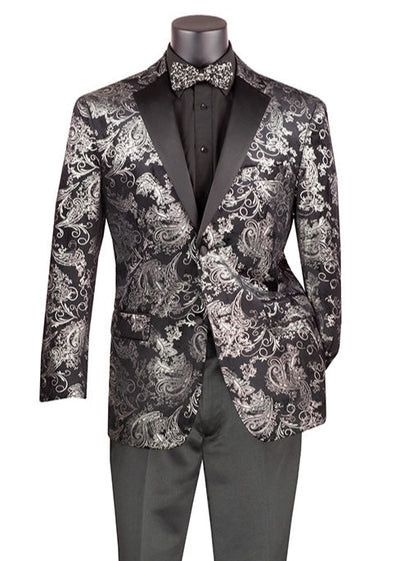 A mannequin displays the Vinci Suits Modern Fit Velvet Jacket BM-02, featuring a sleek black design with silver metallic paisley patterns. This sophisticated piece is complemented by a black shirt and matching bow tie, finished with a refined notch lapel in a Poly Rayon blend.