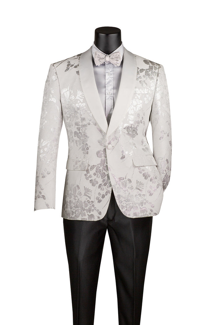 The mannequin showcases the Vinci Suits' Slim Fit Fashion Jacket Shawl Lapel with Bow Tie White BSF-19, featuring a white floral-patterned tuxedo blazer and elegant shawl lapels, paired with a crisp white dress shirt and black pants, perfect for elevating any formal occasion.