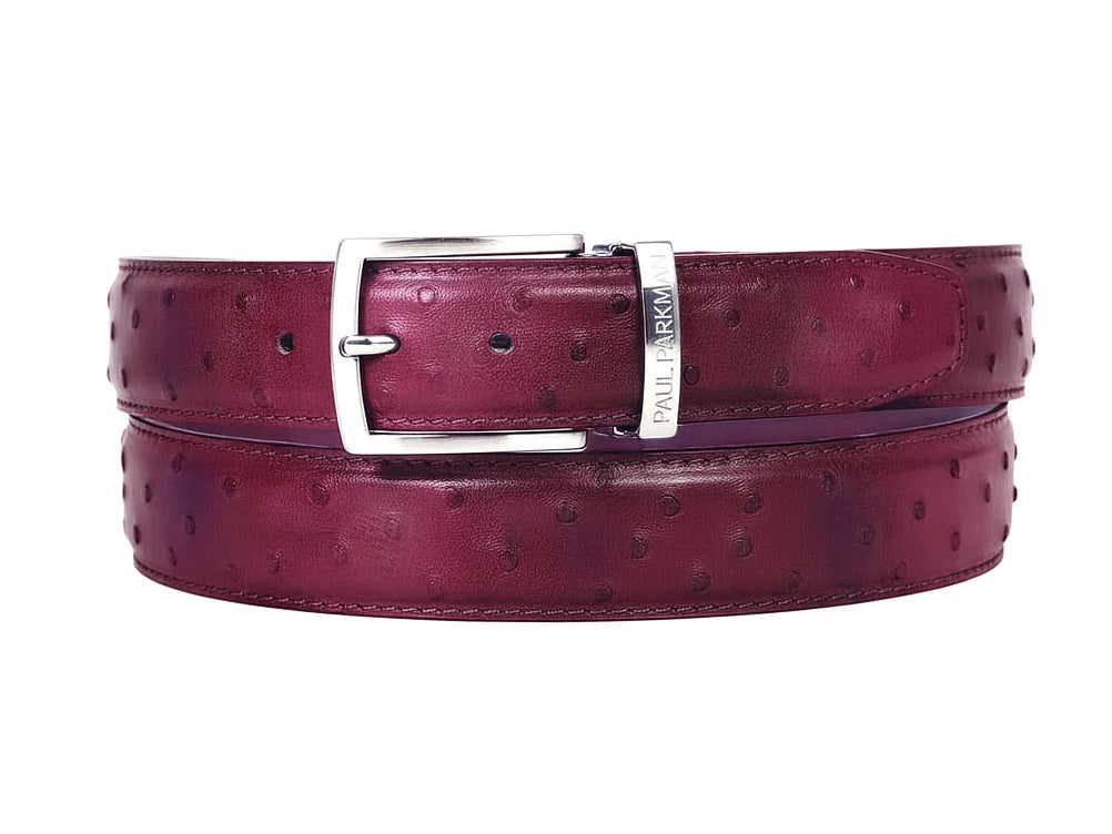 The Paul Parkman Men's Handmade Genuine Ostrich Skin Belt in Burgundy B04 features a silver buckle, embossed dot pattern, and a small metal tag with embossed text for an exotic, luxury touch.