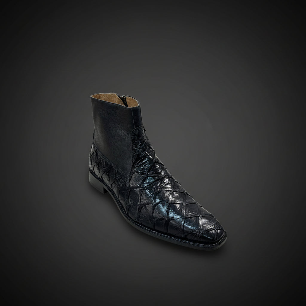 A single Belvedere Shoe 11 in black textured leather (Size 9 Only) by BELVEDERE is displayed on a wooden surface with folded clothing and shoes in the background. Please note: this clearance item is FINAL SALE and cannot be returned or exchanged.