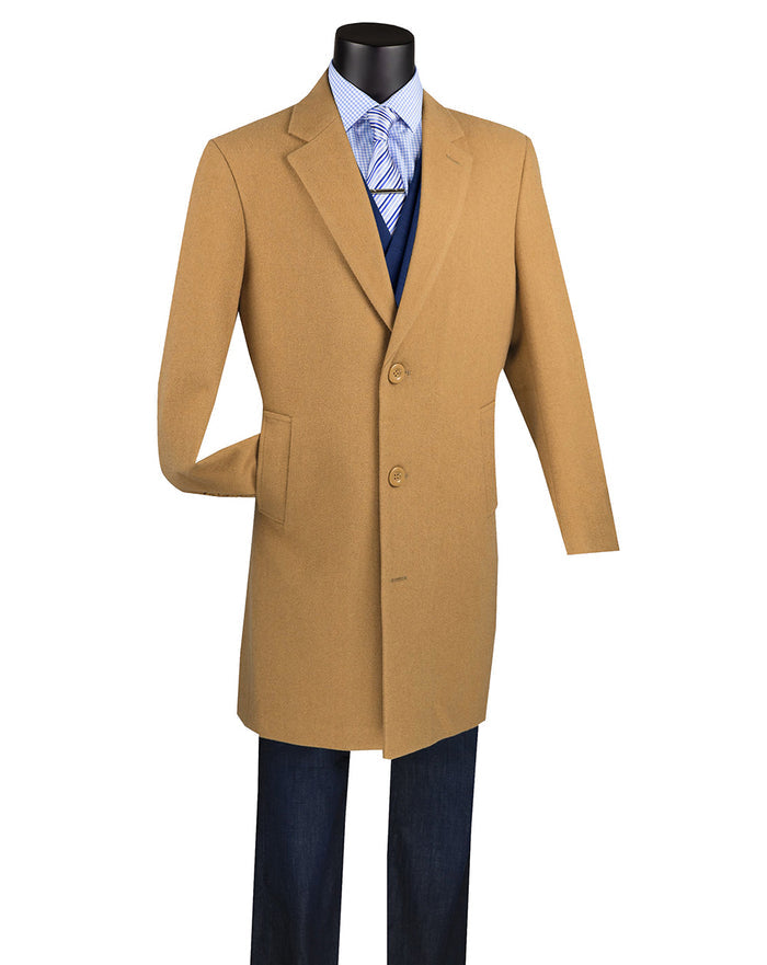 The Vinci Suits Wool & Cashmere Regular Fit Top Coat 38" Long in Camel (CL38) drapes elegantly over a blue suit jacket, dress shirt, and tie on the mannequin, paired with dark pants, offering timeless sophistication and style.
