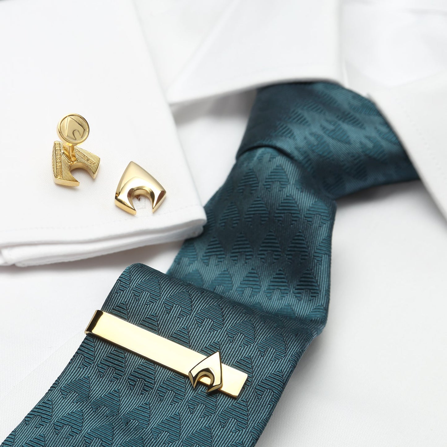 The DC Aquaman Men's Tie by Cufflinks.com features a teal silk geometric pattern—a stylish, subtle nod to Aquaman that makes it the perfect standout accessory for any DC Comics fan.