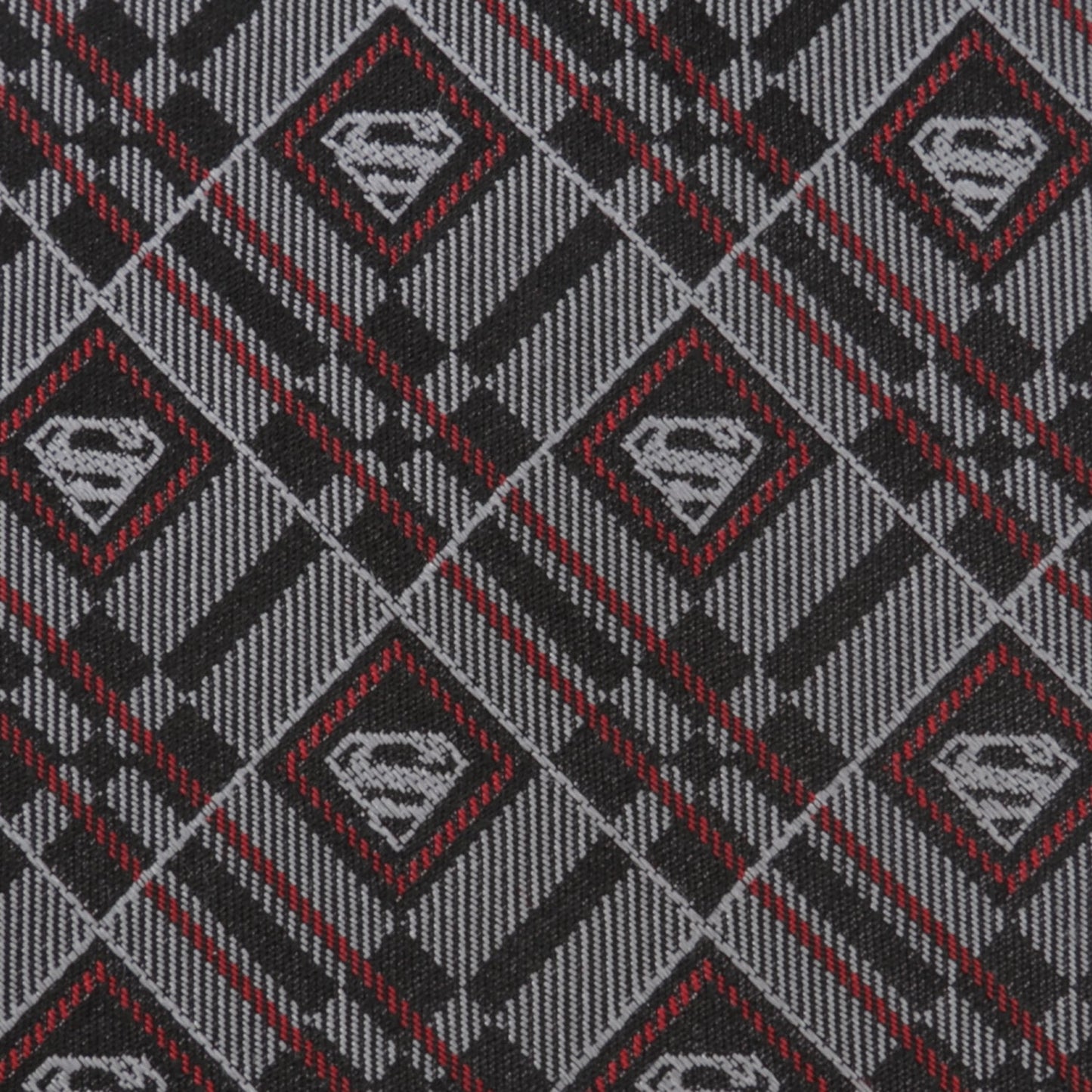 The DC Superman Geometric Gray Silk Men's Tie by Cufflinks.com is a rolled-up silk tie featuring a geometric plaid pattern with diamond-shaped accents in gray.
