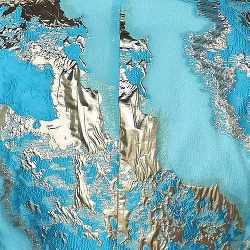 A man in the Insomnia MANZINI DELMAS 3-Piece Slim Fit Shiny Metallic Pattern Sky Tuxedo Prom Suit, featuring a vibrant blue and gold floral design, with a coordinating bow tie, stands against a textured backdrop.