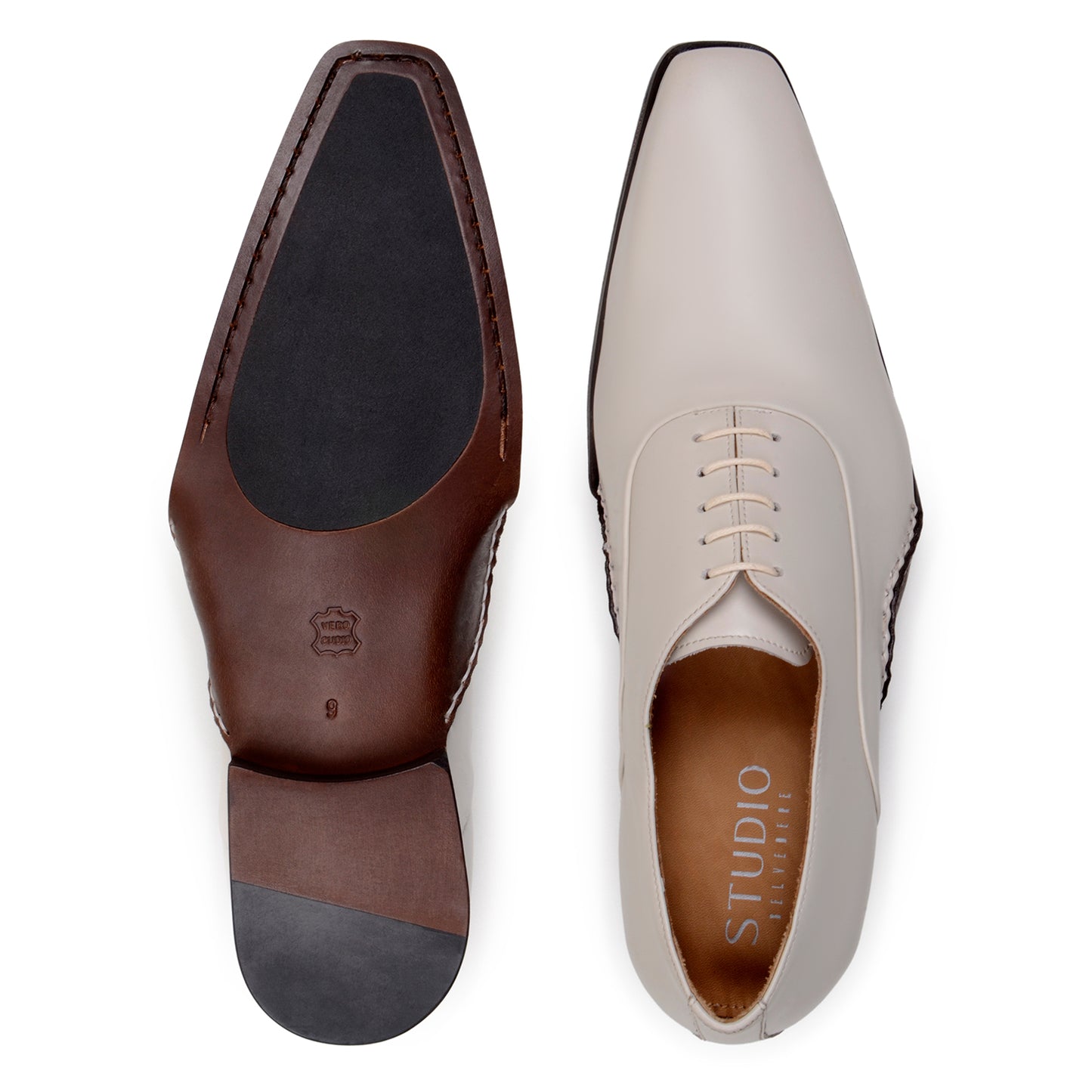The BELVEDERE Belvedere - Bianca Italian Calf Dress Shoe in Light Bone is a cream-colored full leather oxford with a low heel, brown sole, white stitching, and closed lacing, shown in profile against a white background.