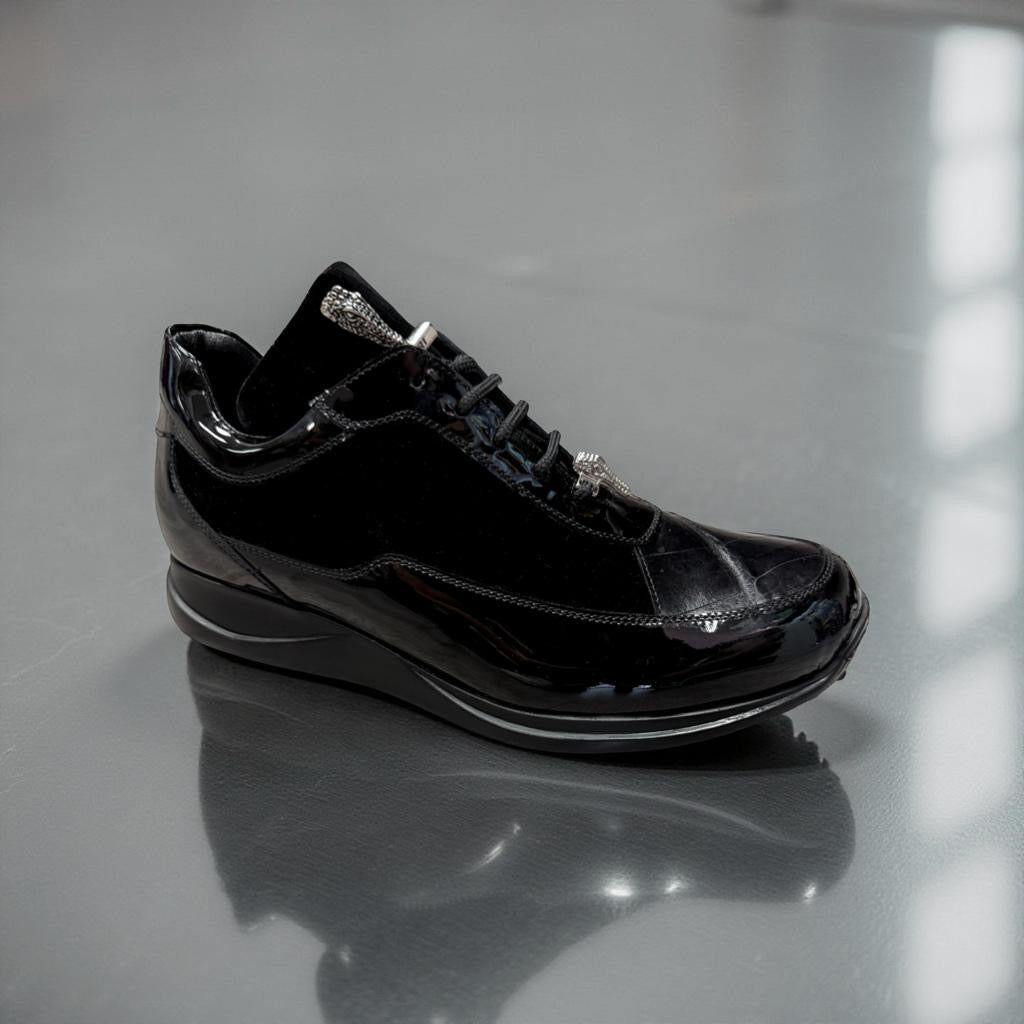 The Mauri 8900/8 Velvet Embossed Alligator Patent Black Shoes, featuring black laces and a glossy finish inspired by baby crocodile textures, are displayed on a gray surface.