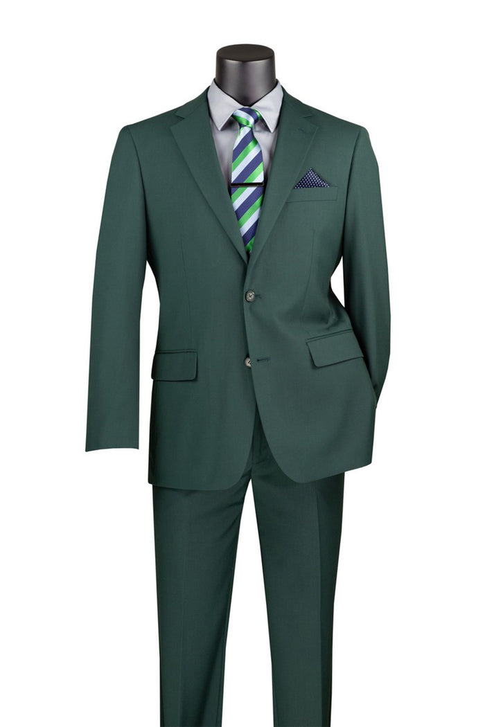 The Vinci Suits 2 Piece Suit in Hunter Green F-2C900 pairs a white shirt with a green-blue striped tie and blue pocket square. Crafted for luxury, it features a notch lapel and an adjustable waistband for the perfect fit.