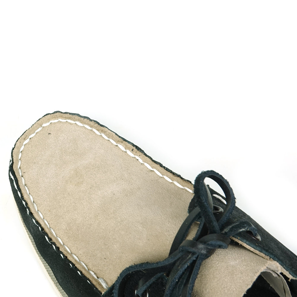 The FI-6512-S Black Beige by Fiesso is a premium genuine suede boat shoe featuring a two-tone design, black laces, white stitching, and a white sole—bringing handcrafted elegance to men's footwear.